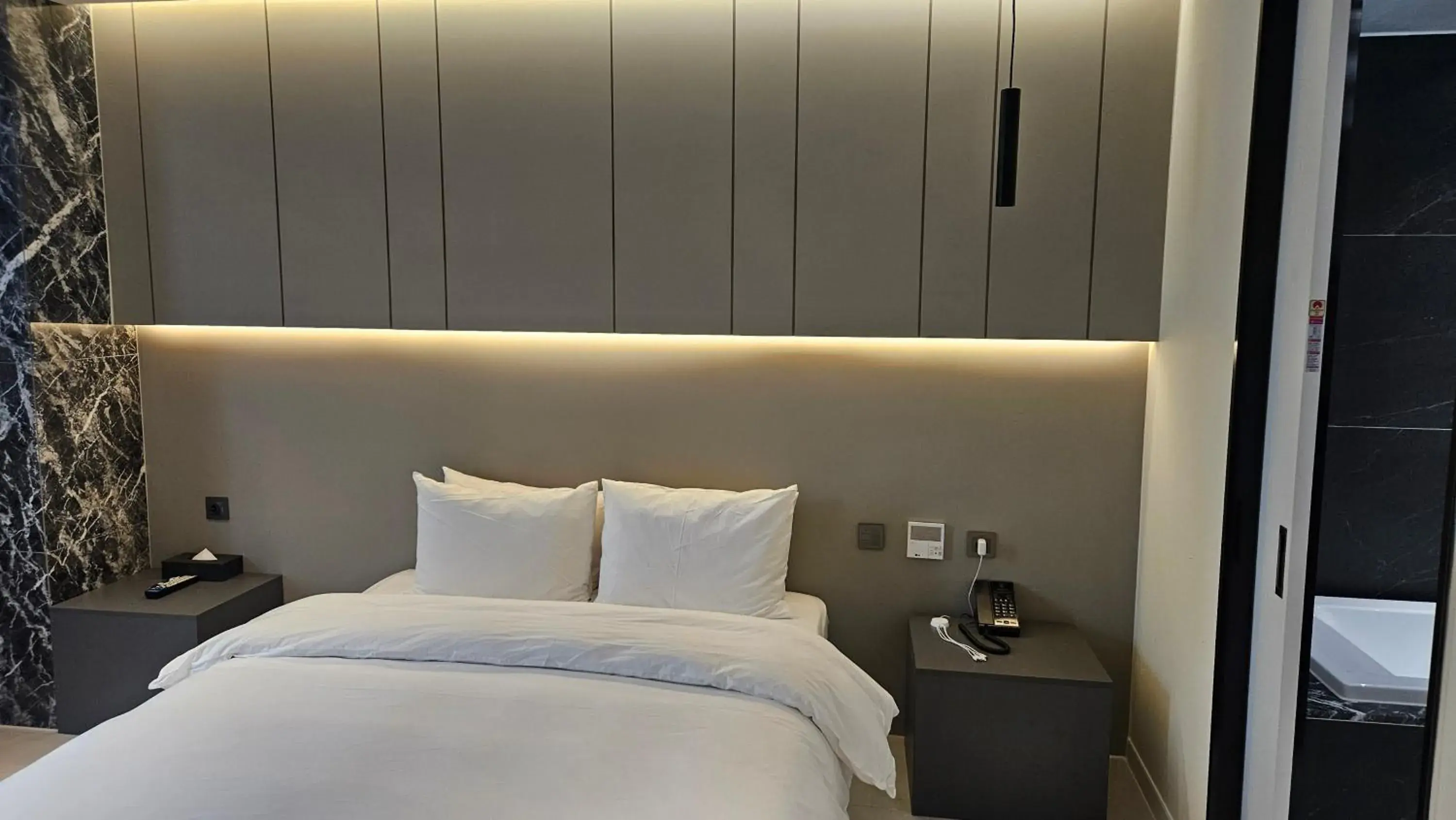 Bed in The Gleam Hotel Bed in The Gleam Hotel