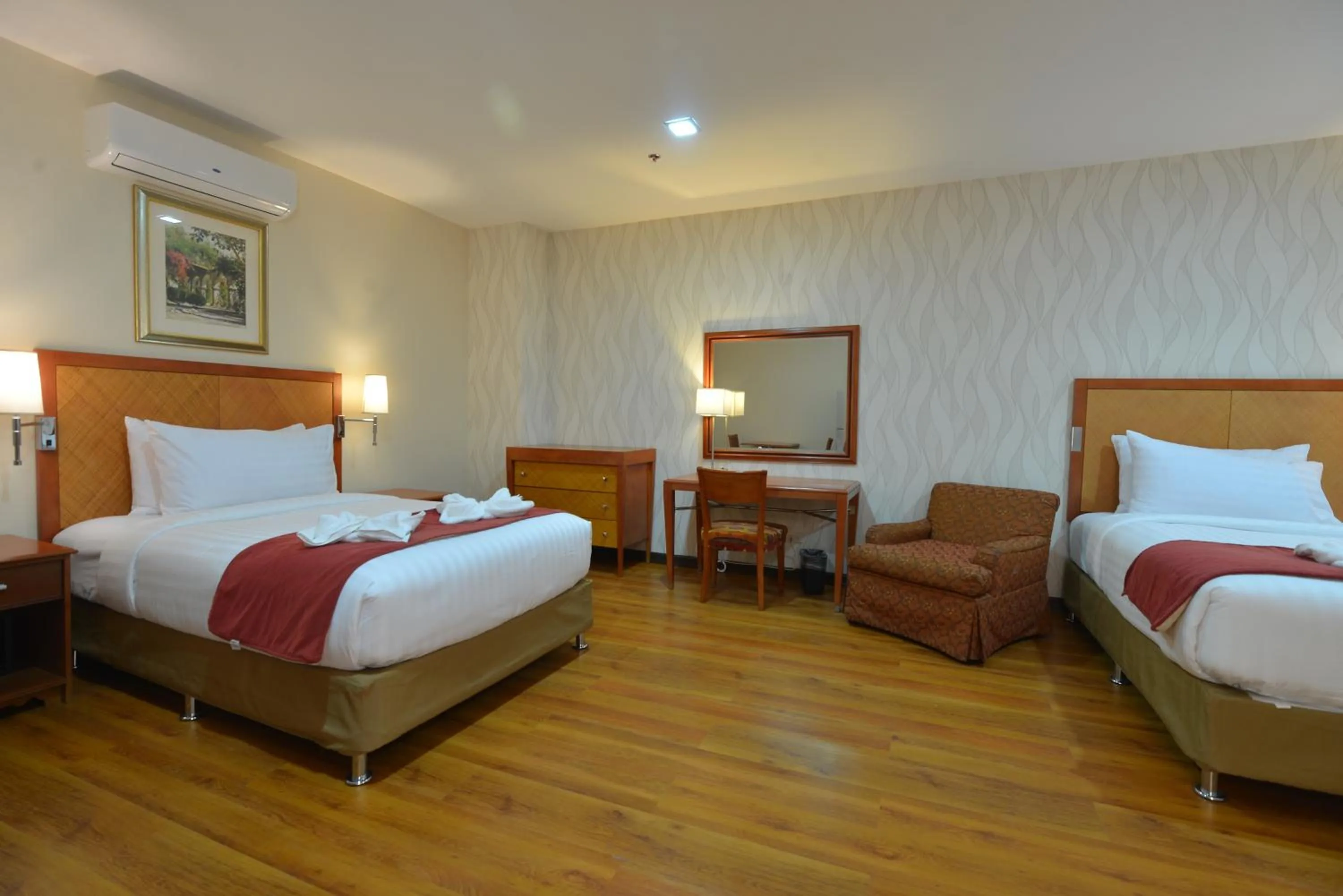 Bed in Royal Suites Condotel