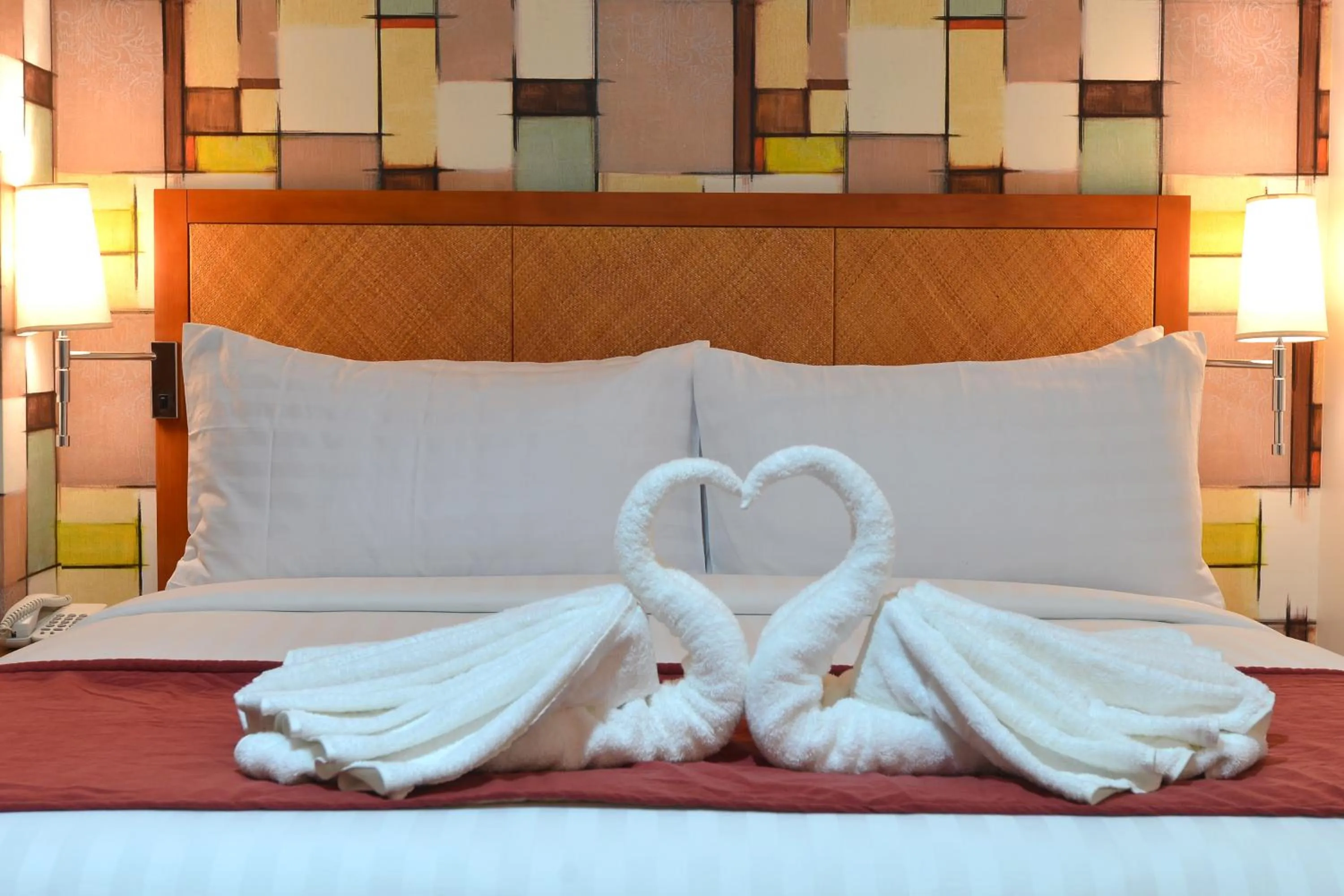 Bed in Royal Suites Condotel