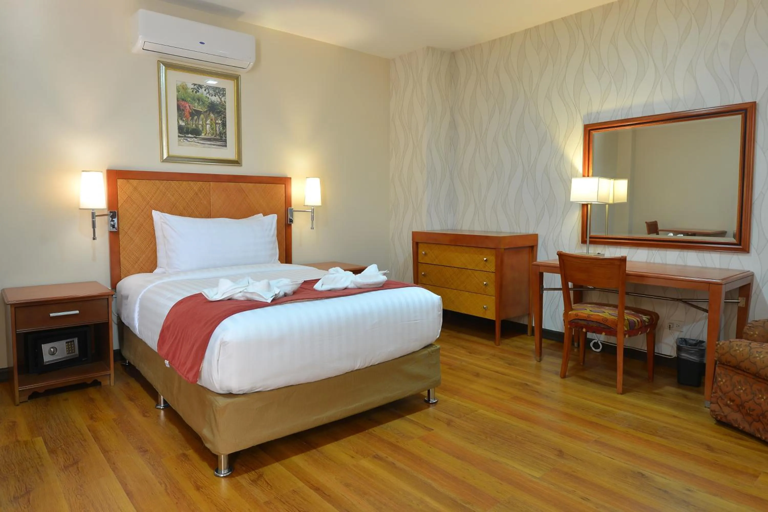 Bed in Royal Suites Condotel