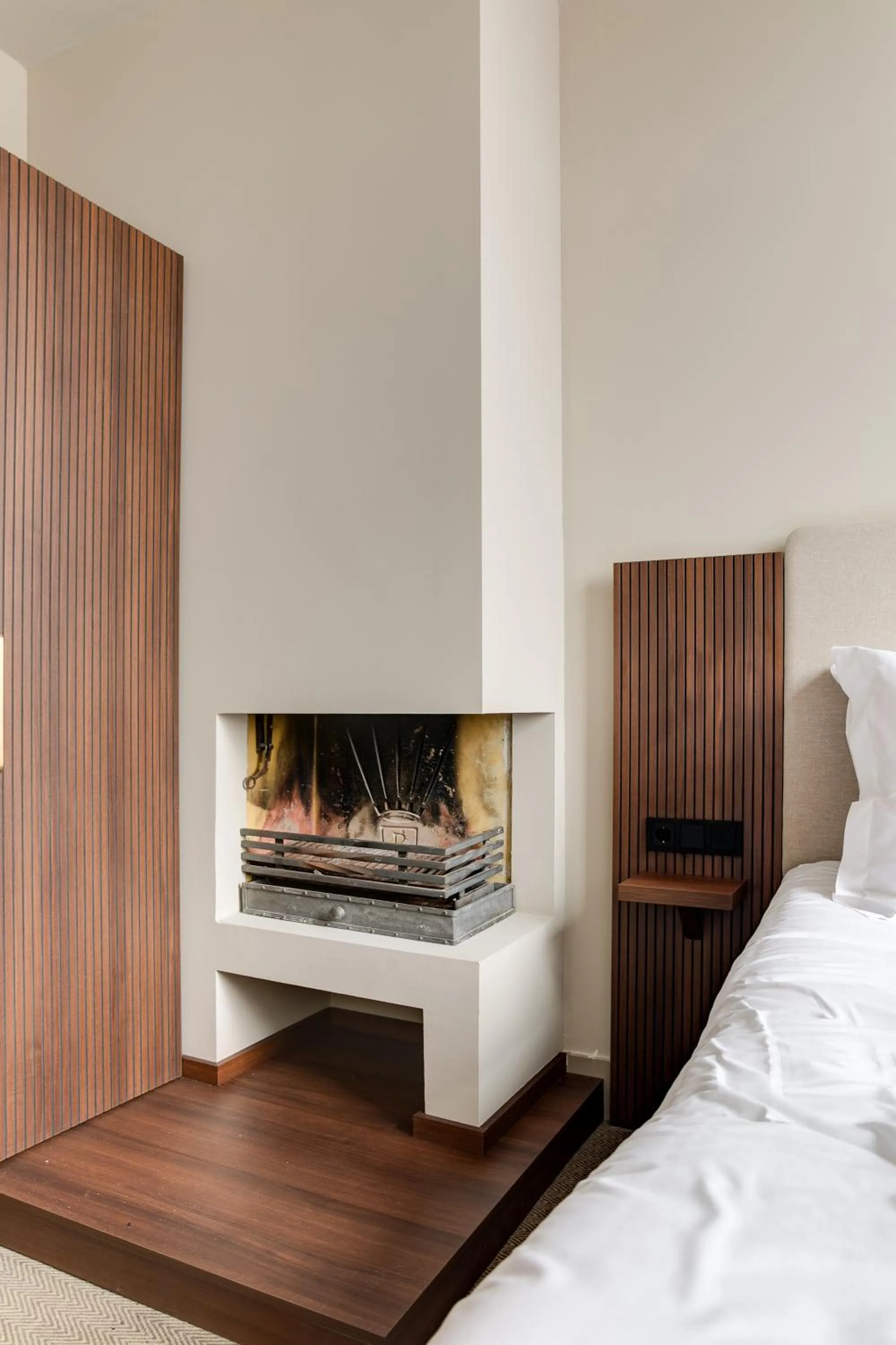 fireplace, Bed in The Saints Hotel