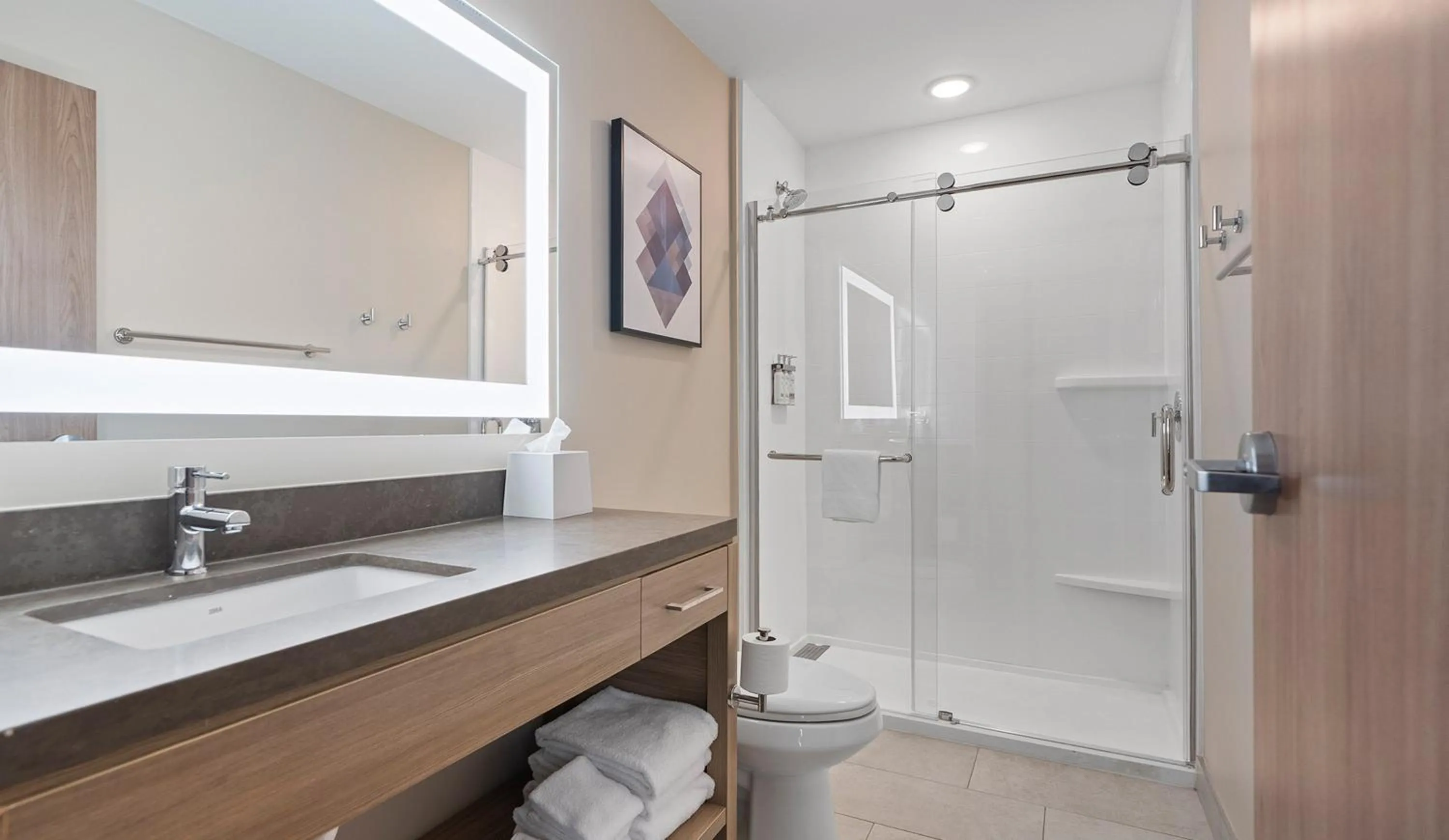 Bathroom in Candlewood Suites Perry-National Fairground Area by IHG
