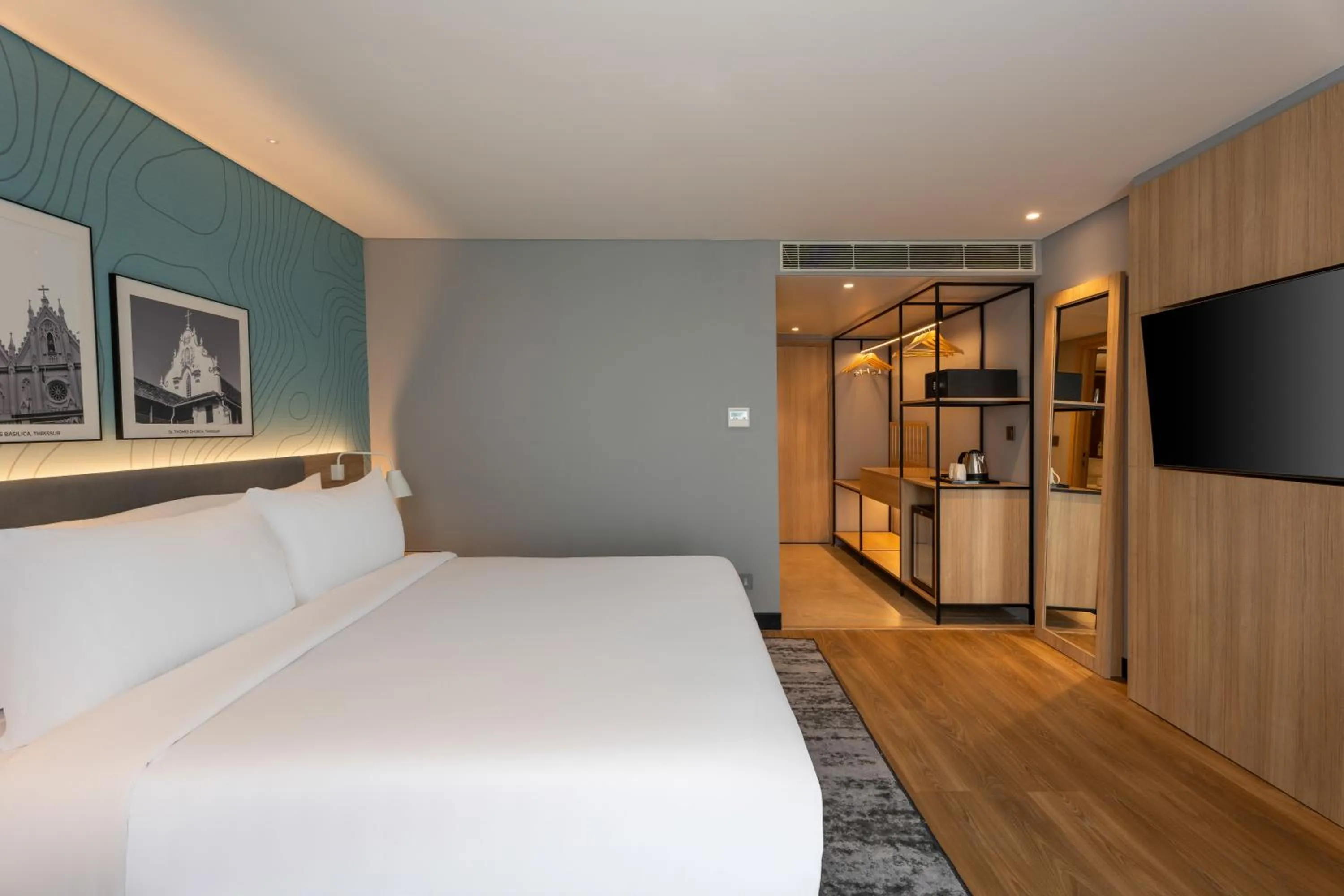 Photo of the whole room, Bed in Park Inn & Suites by Radisson Thrissur East Fort