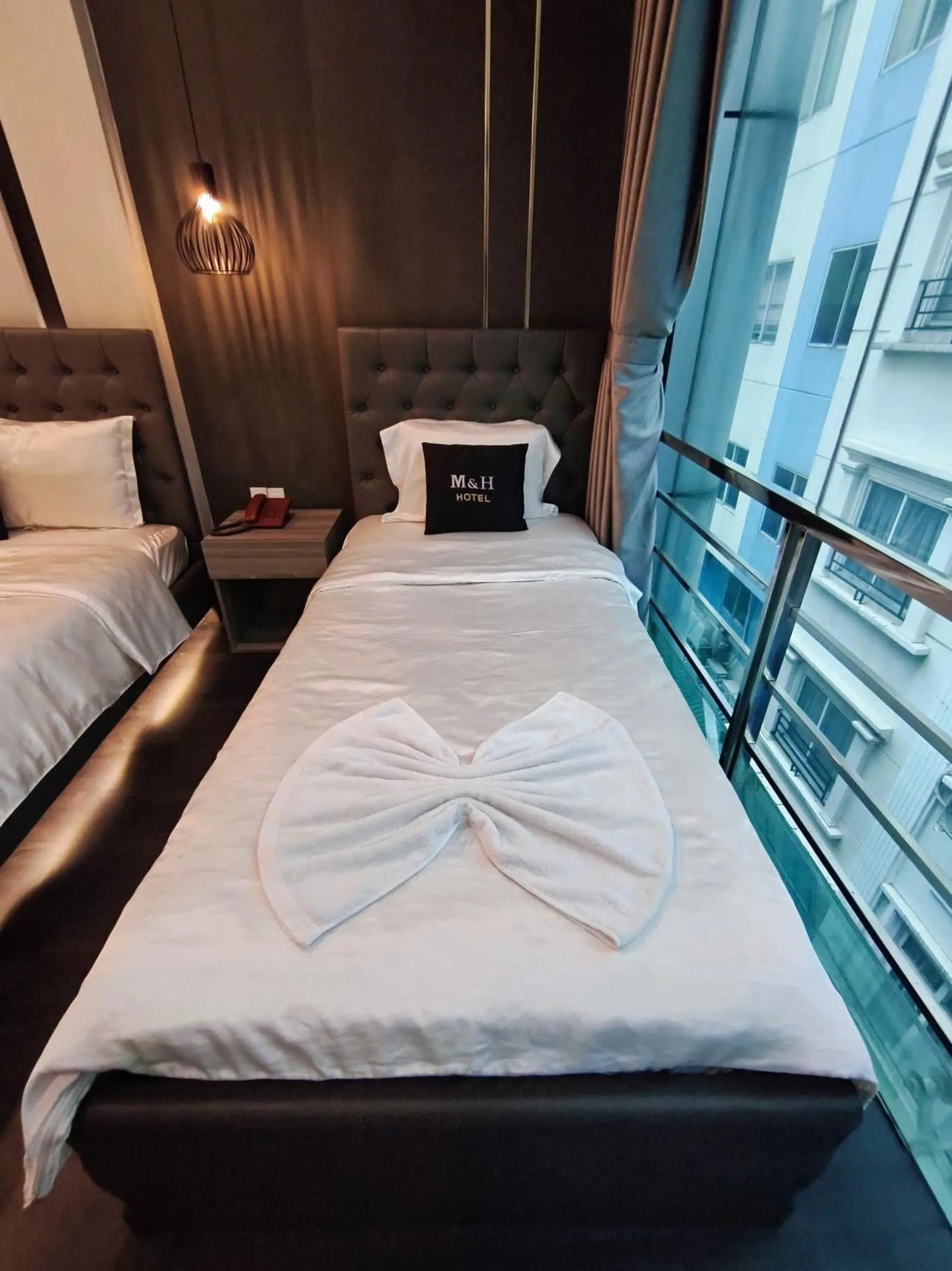 Bed in M&H Hotel