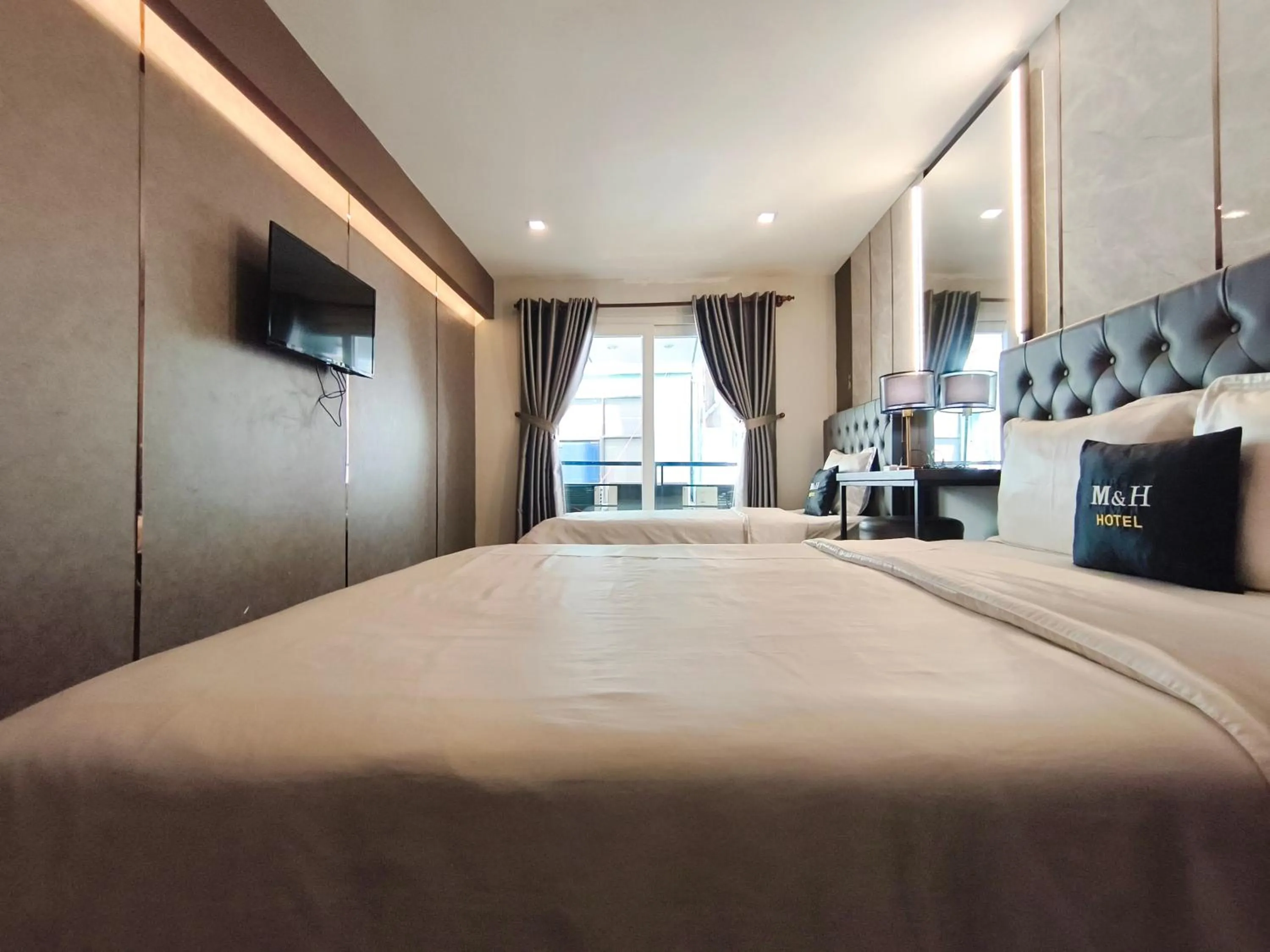 Photo of the whole room, Bed in M&H Hotel