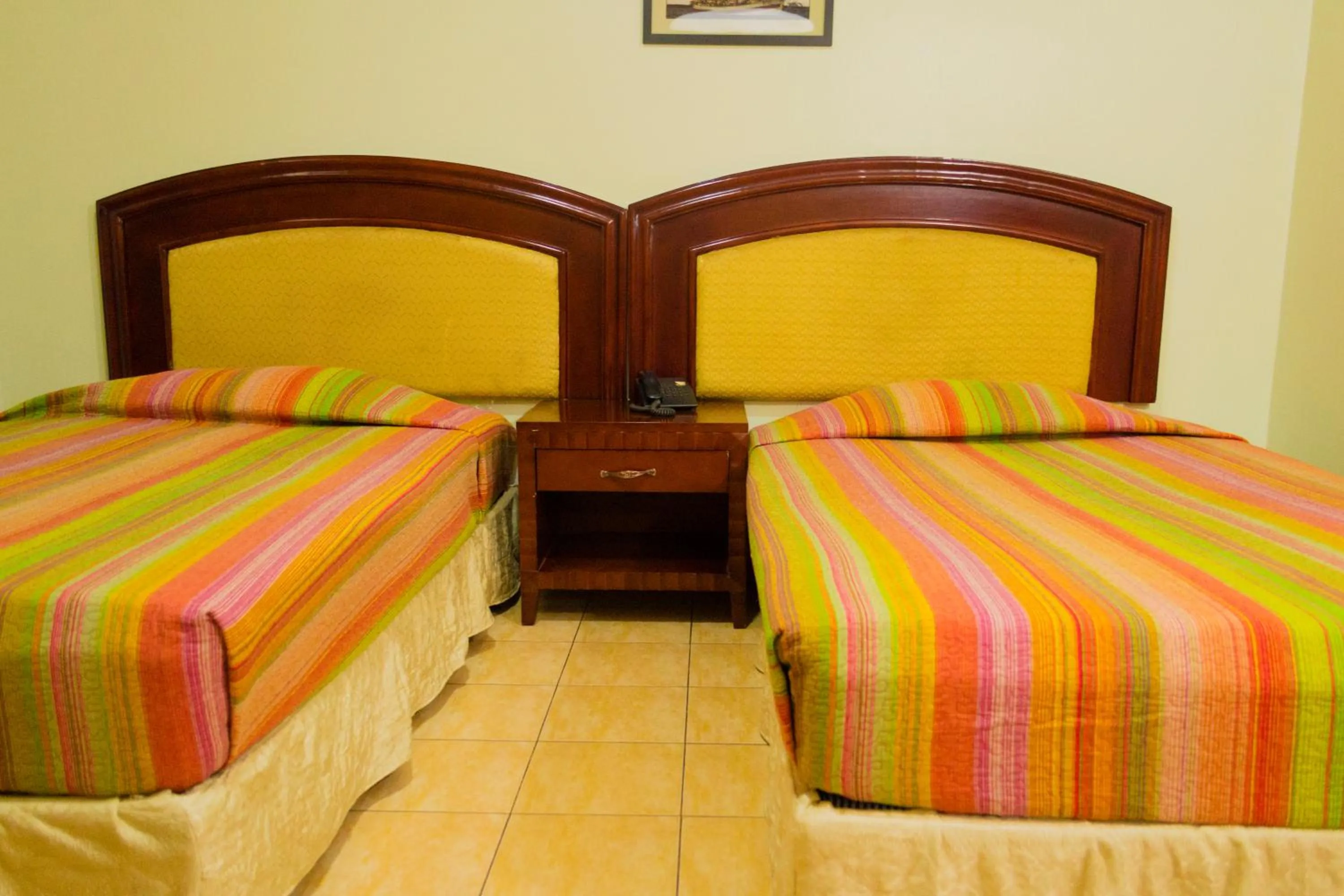 Bed in Emerald Hotel Kampala