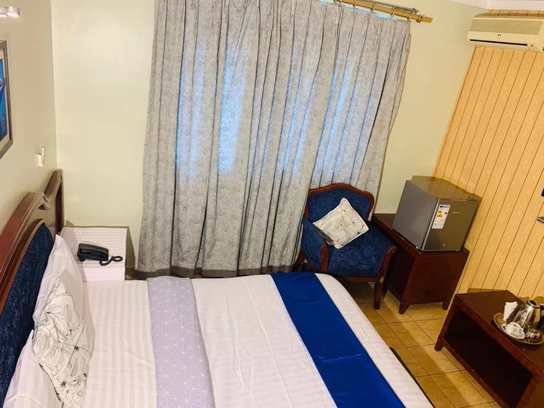 Bed in Emerald Hotel Kampala