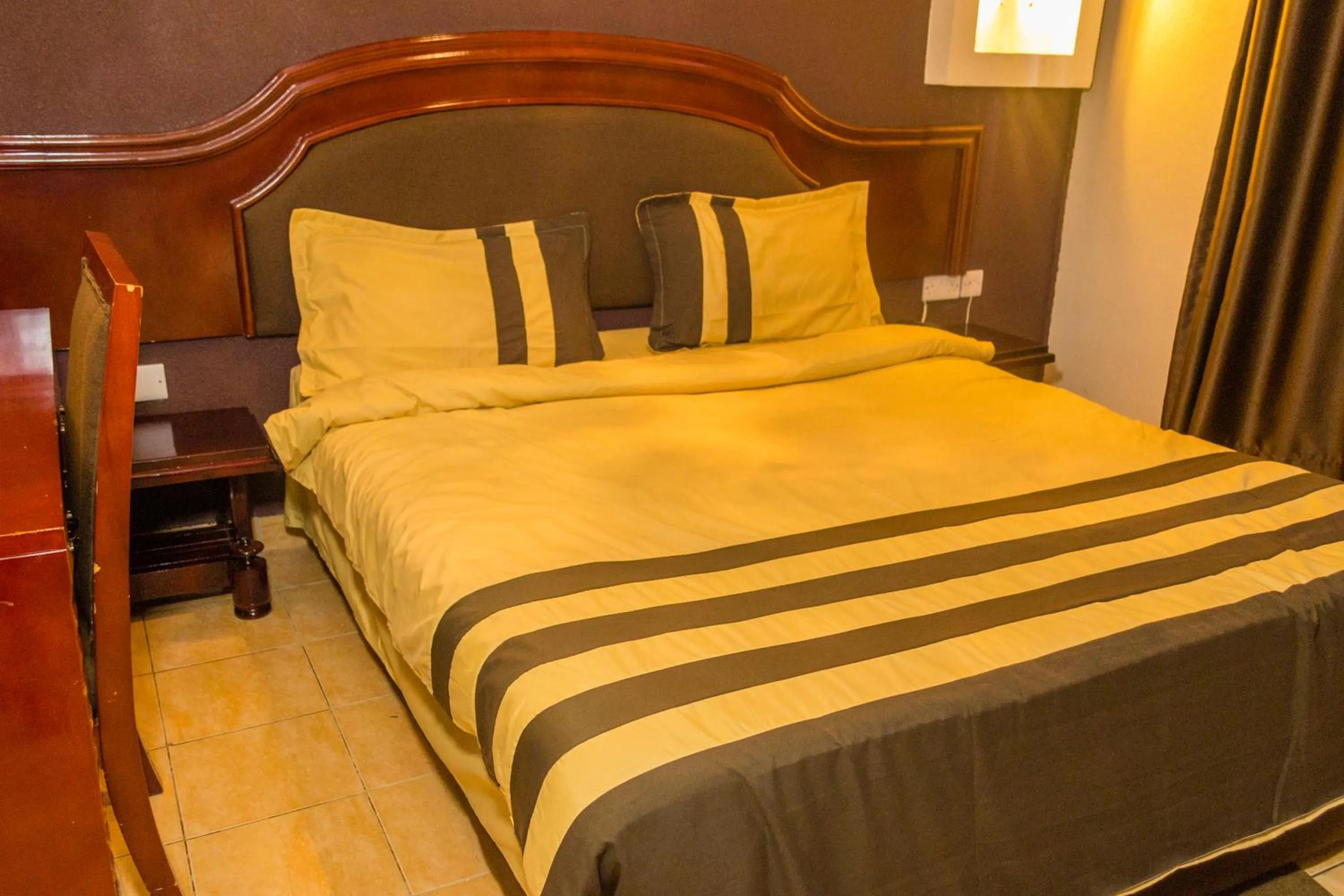 Bed in Emerald Hotel Kampala