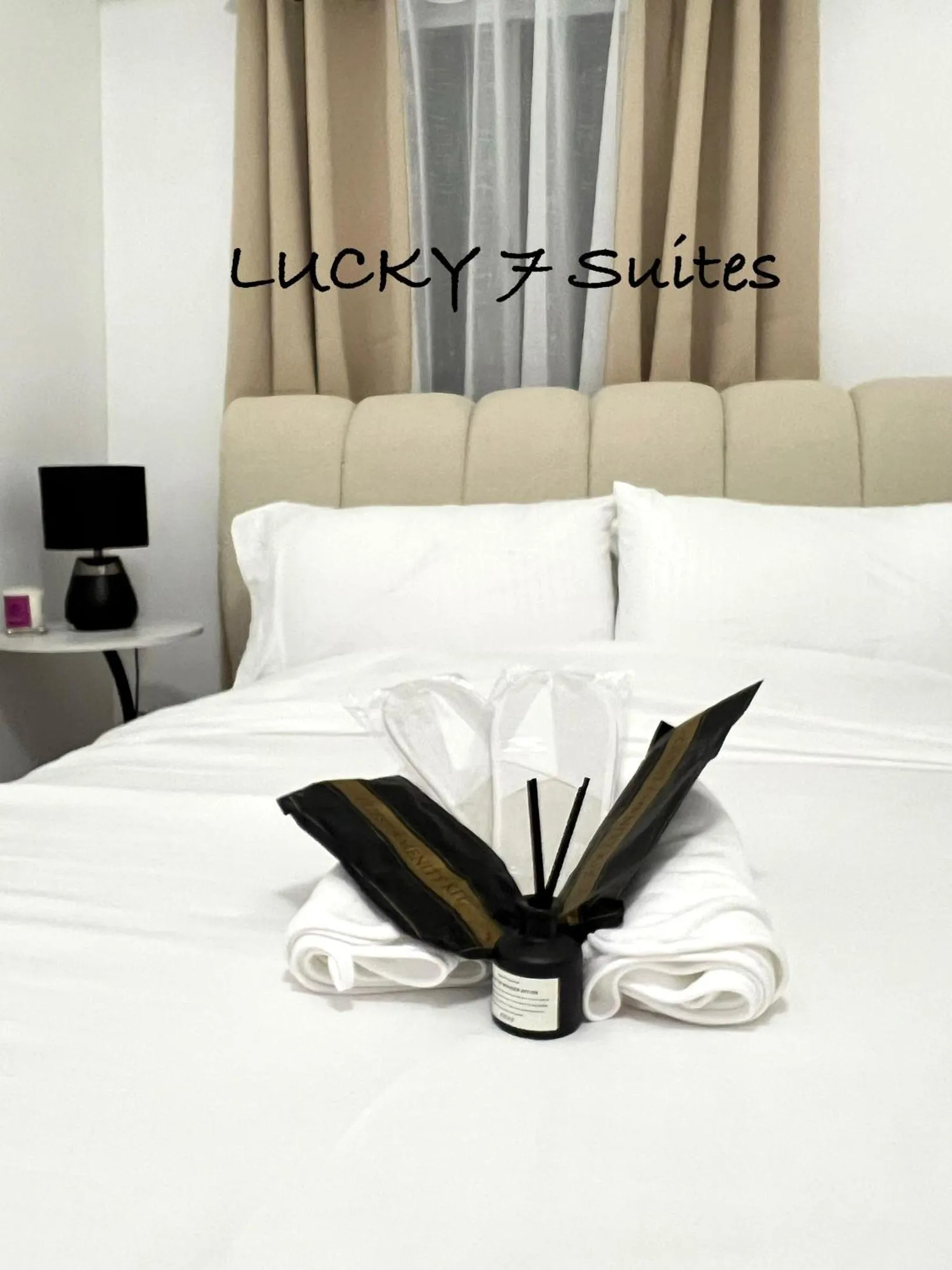 Bed in LUCKY 7 Suites