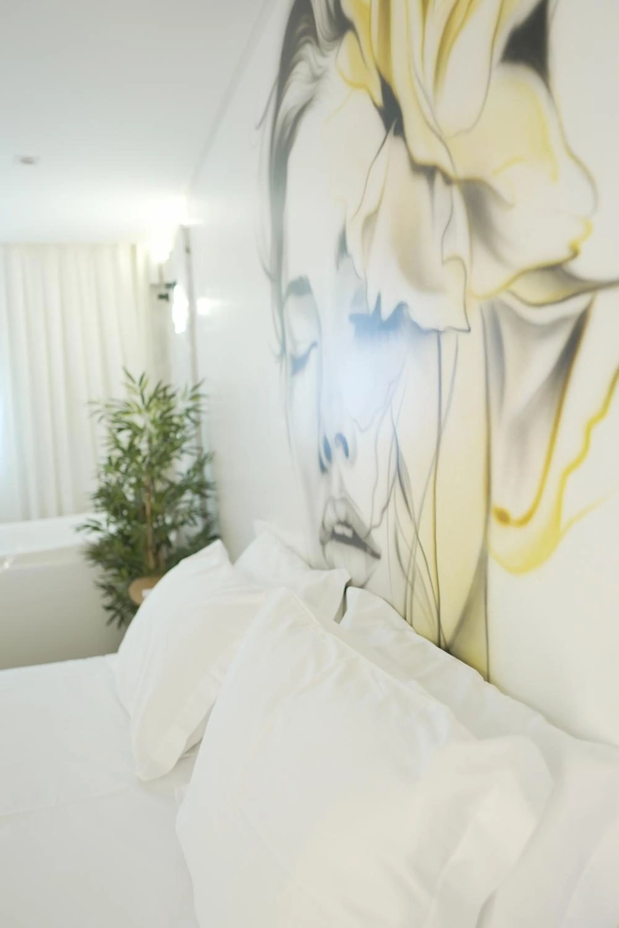 Bed in Up Hotel Boutique