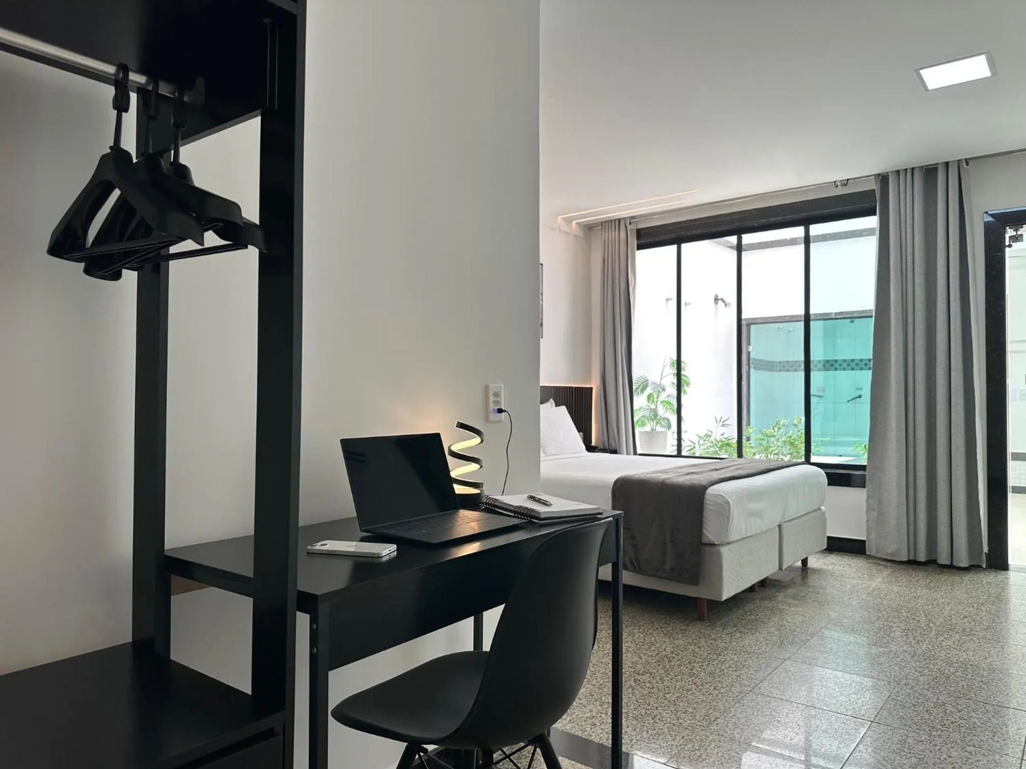 Bed in Status Elegance Hotel