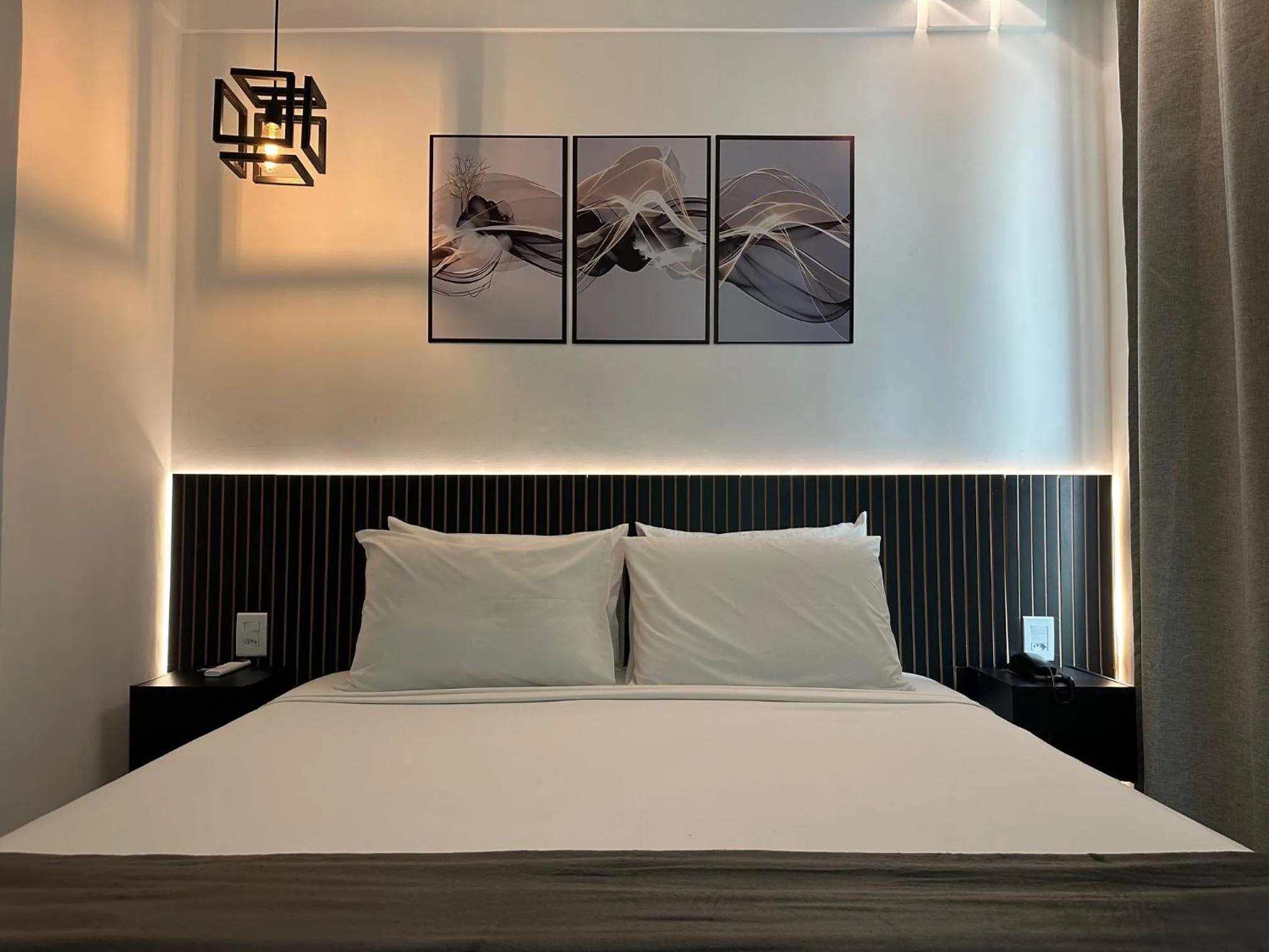 Bed in Status Elegance Hotel