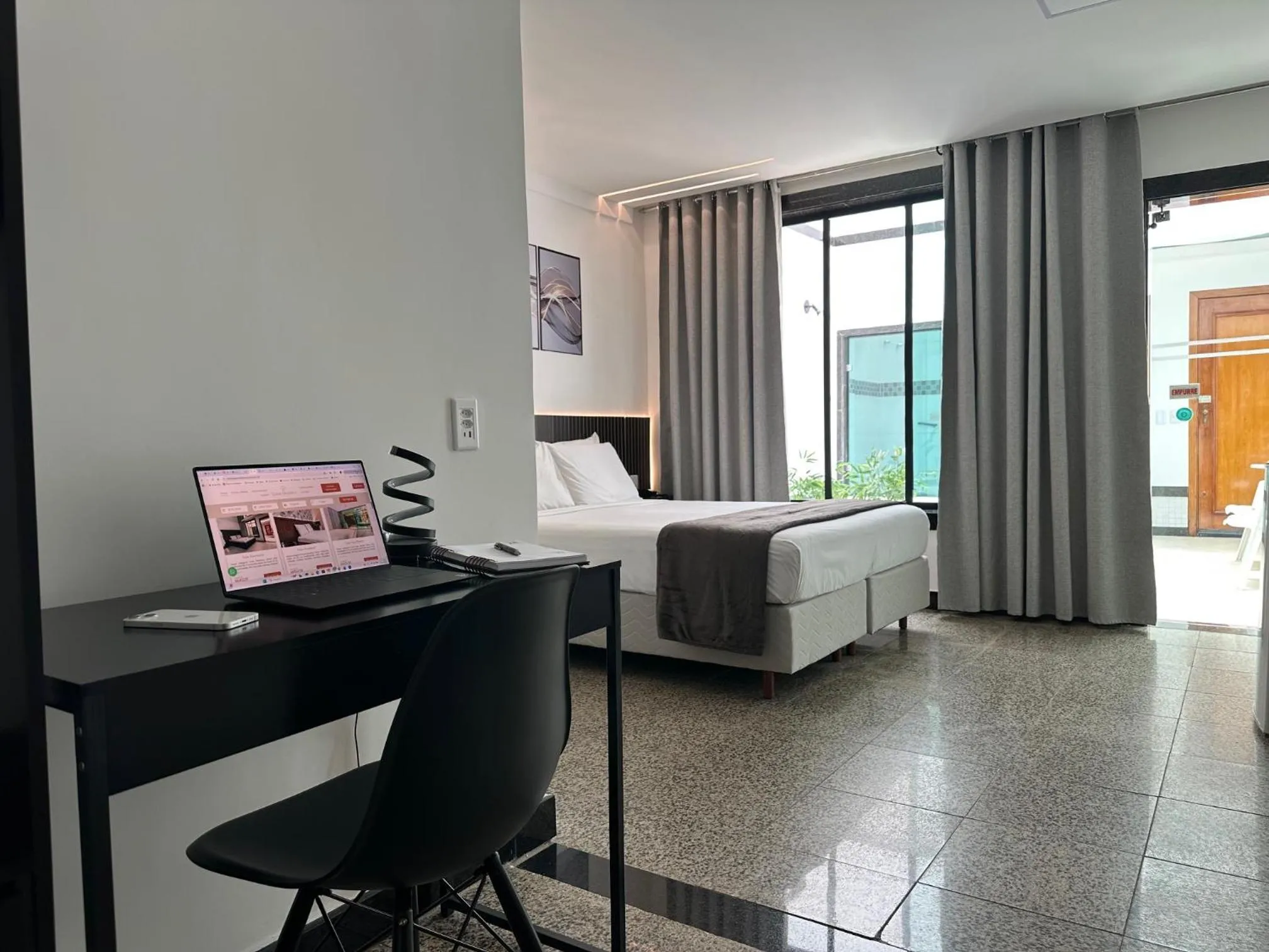 Bed in Status Elegance Hotel