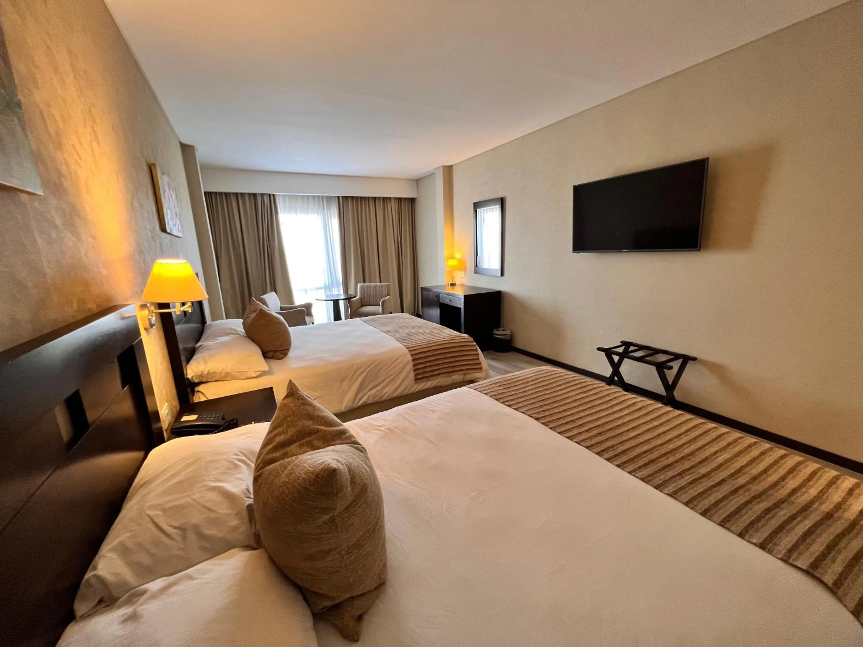 Bed in Howard Johnson Hotel & Resort Funes