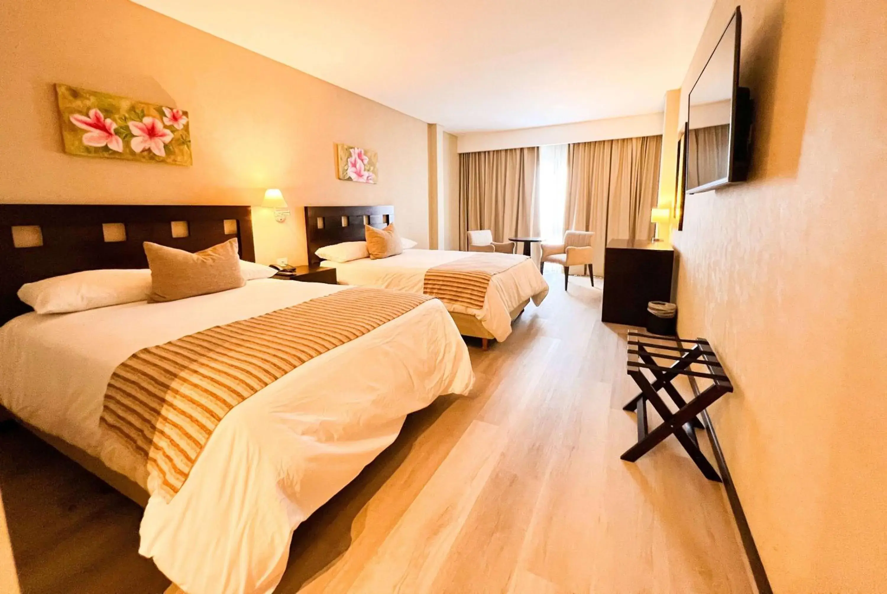 Photo of the whole room, Bed in Howard Johnson Hotel & Resort Funes Photo of the whole room, Bed in Howard Johnson Hotel & Resort Funes