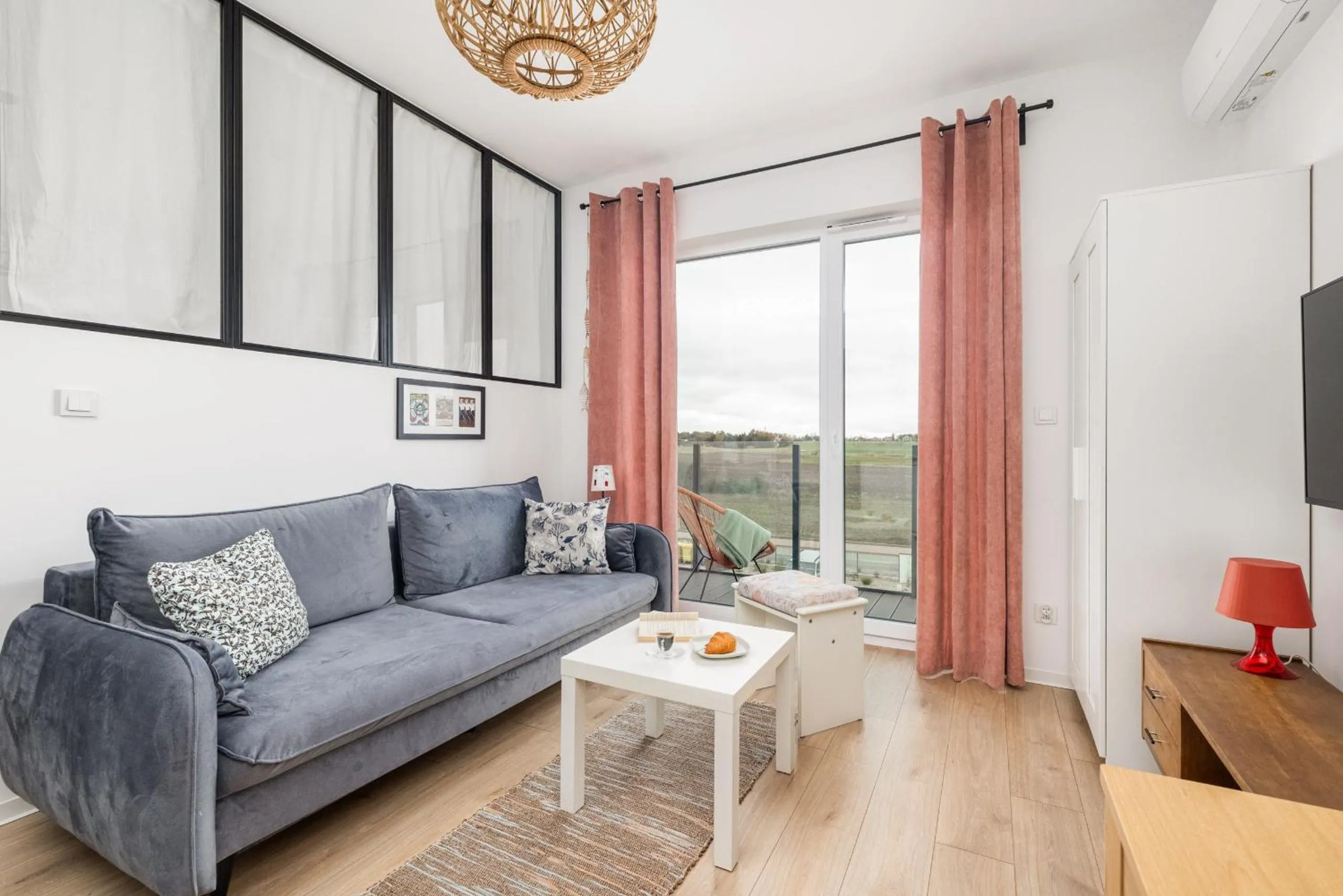Seating area in Szprotka Apartment with Air-Conditioning & Parking by Noclegi Renters