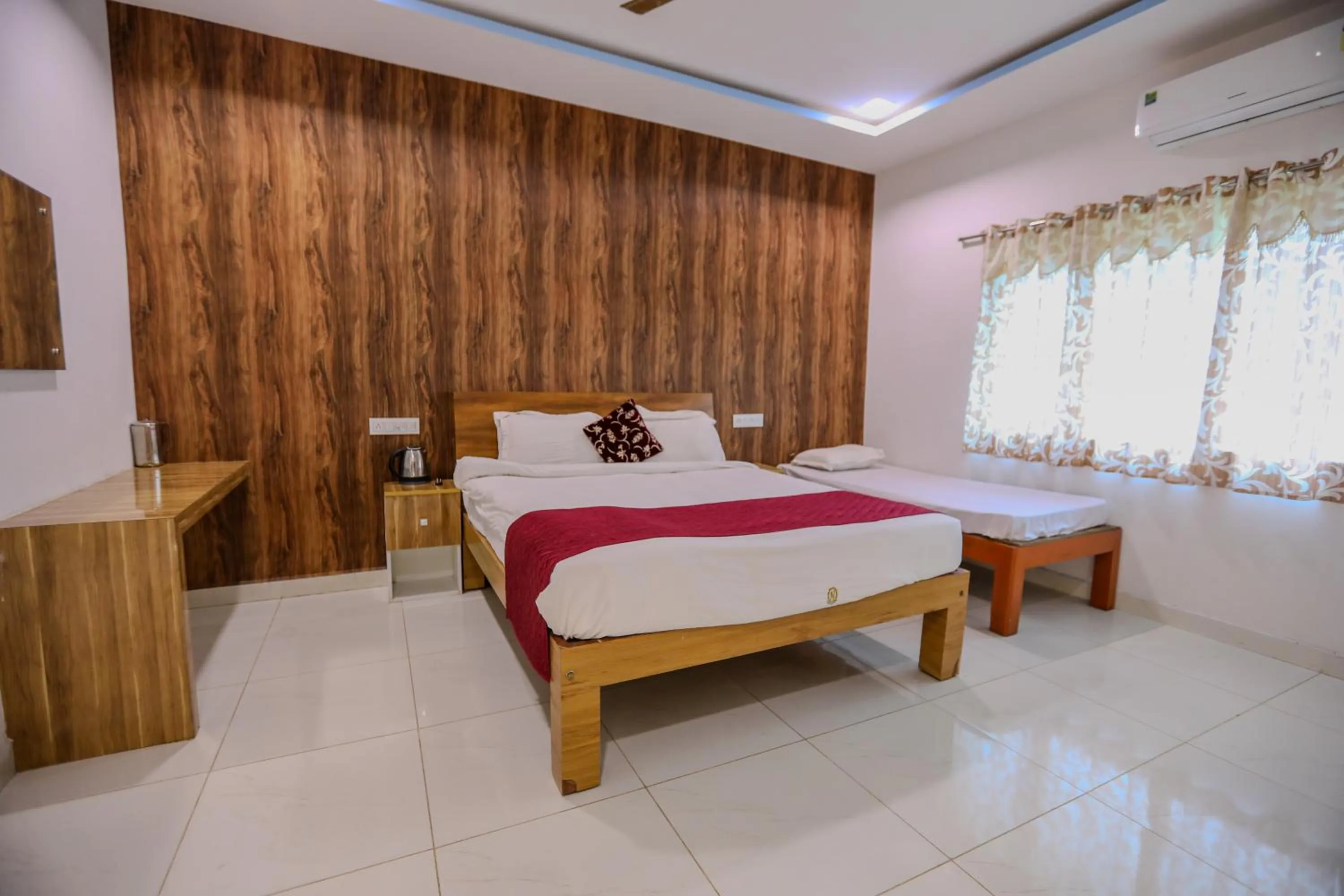 Bed in Thavika O Nila Resort & Convention Centre