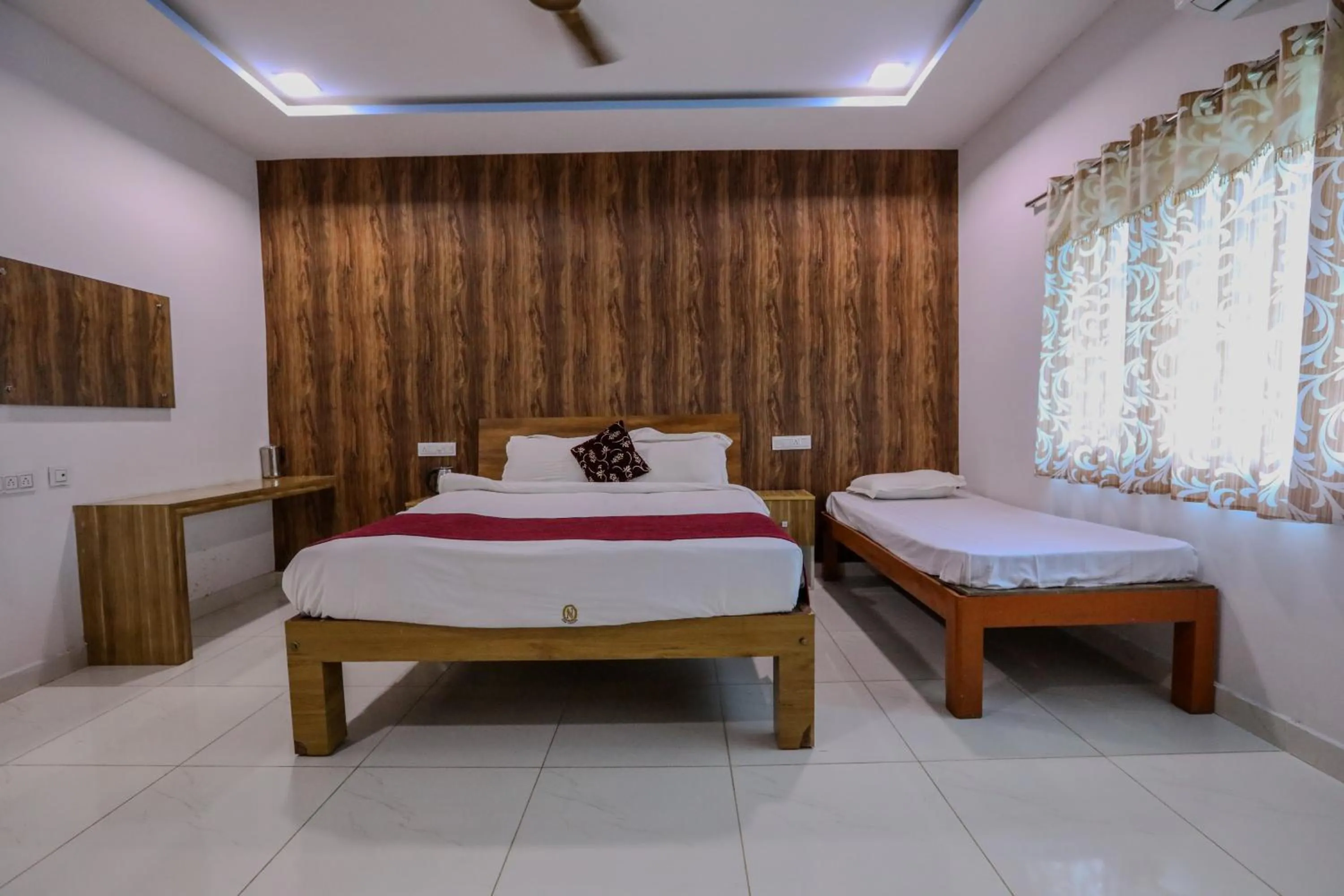Bed in Thavika O Nila Resort & Convention Centre