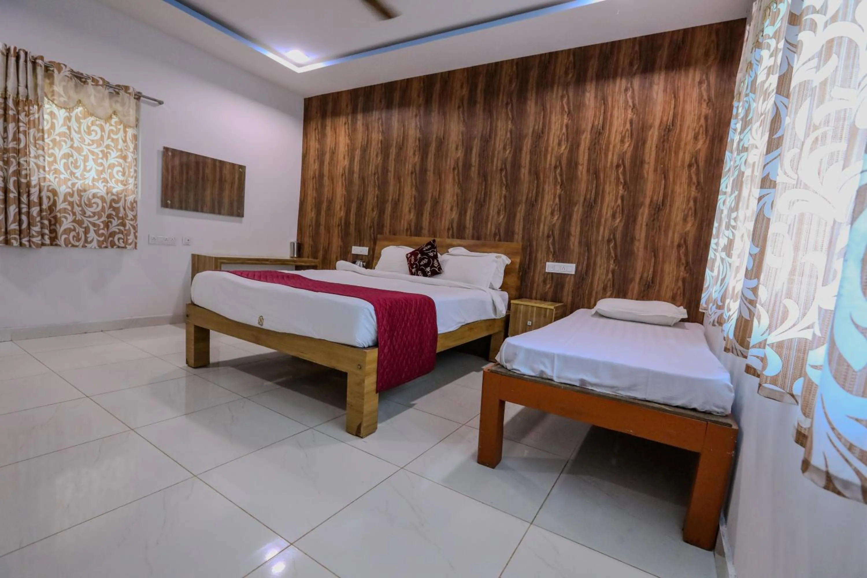 Bed in Thavika O Nila Resort & Convention Centre