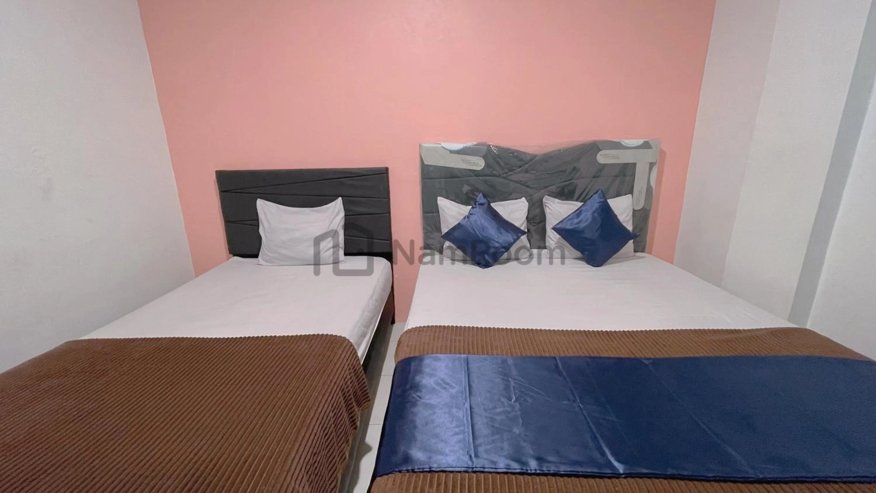 Bed in Cempaka Residence By NamRoom