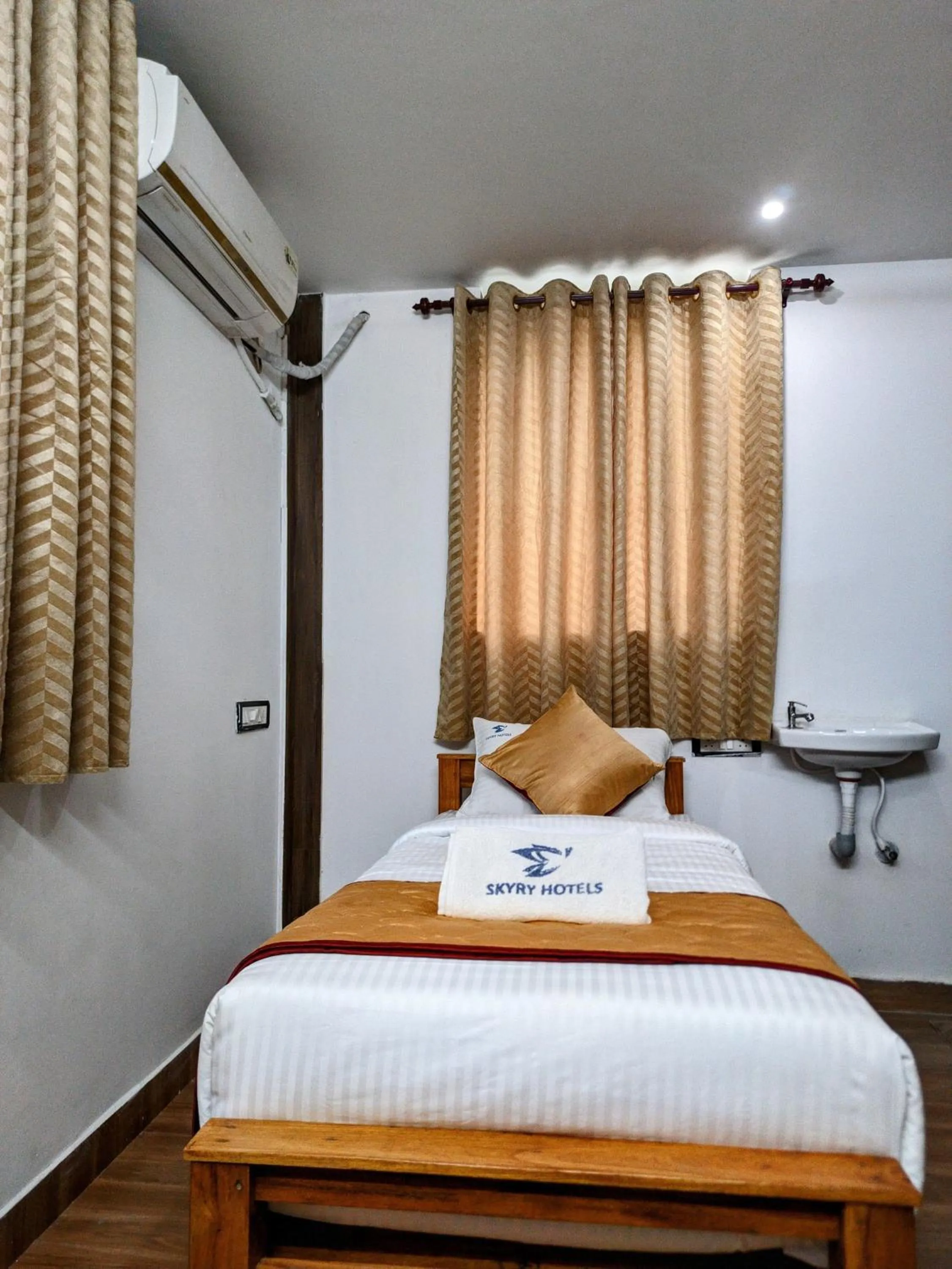 Bed in Skyry Hotels Singanallur