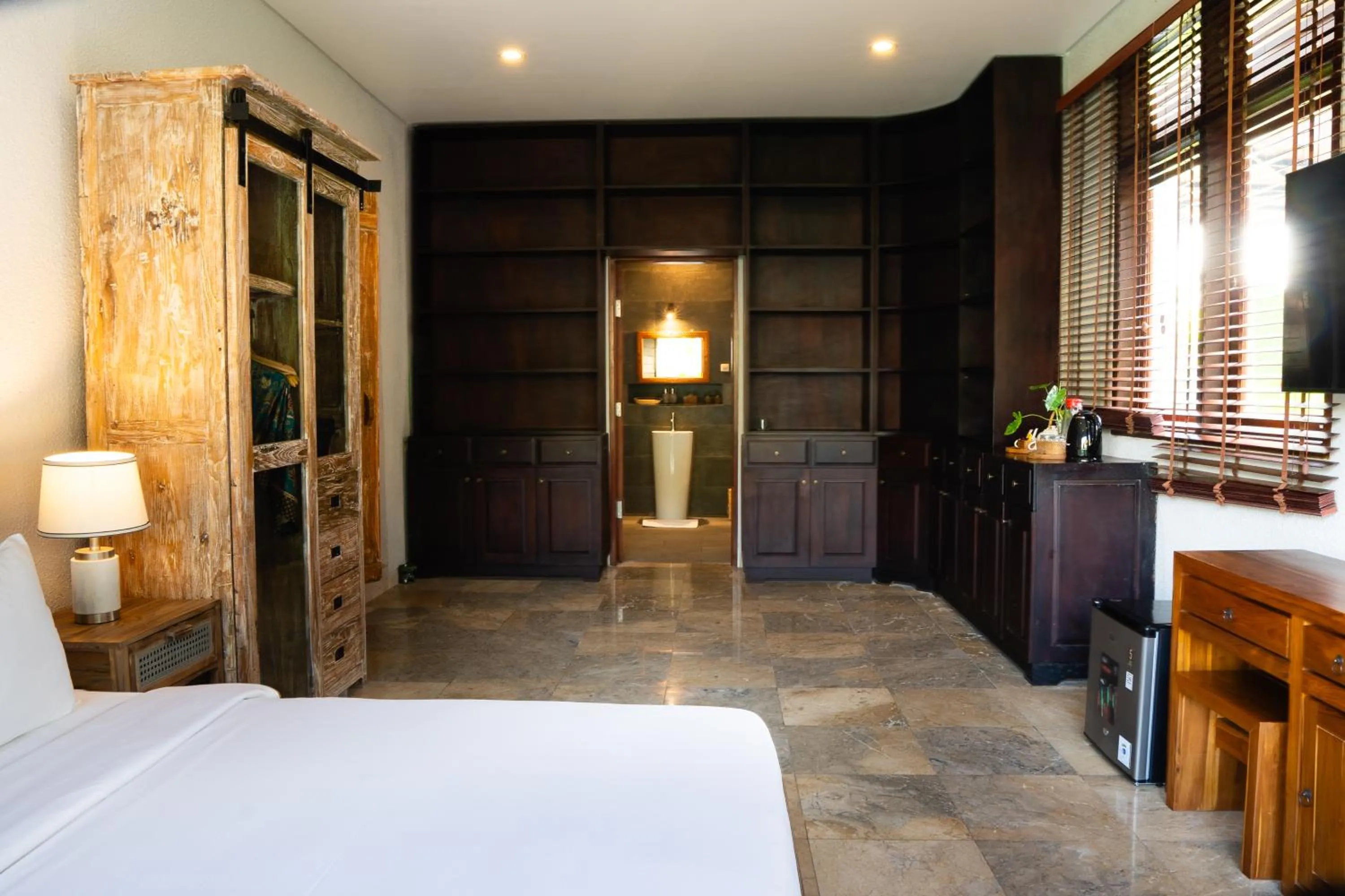 Bed in Seaside Oceana Suites by Mahaprana