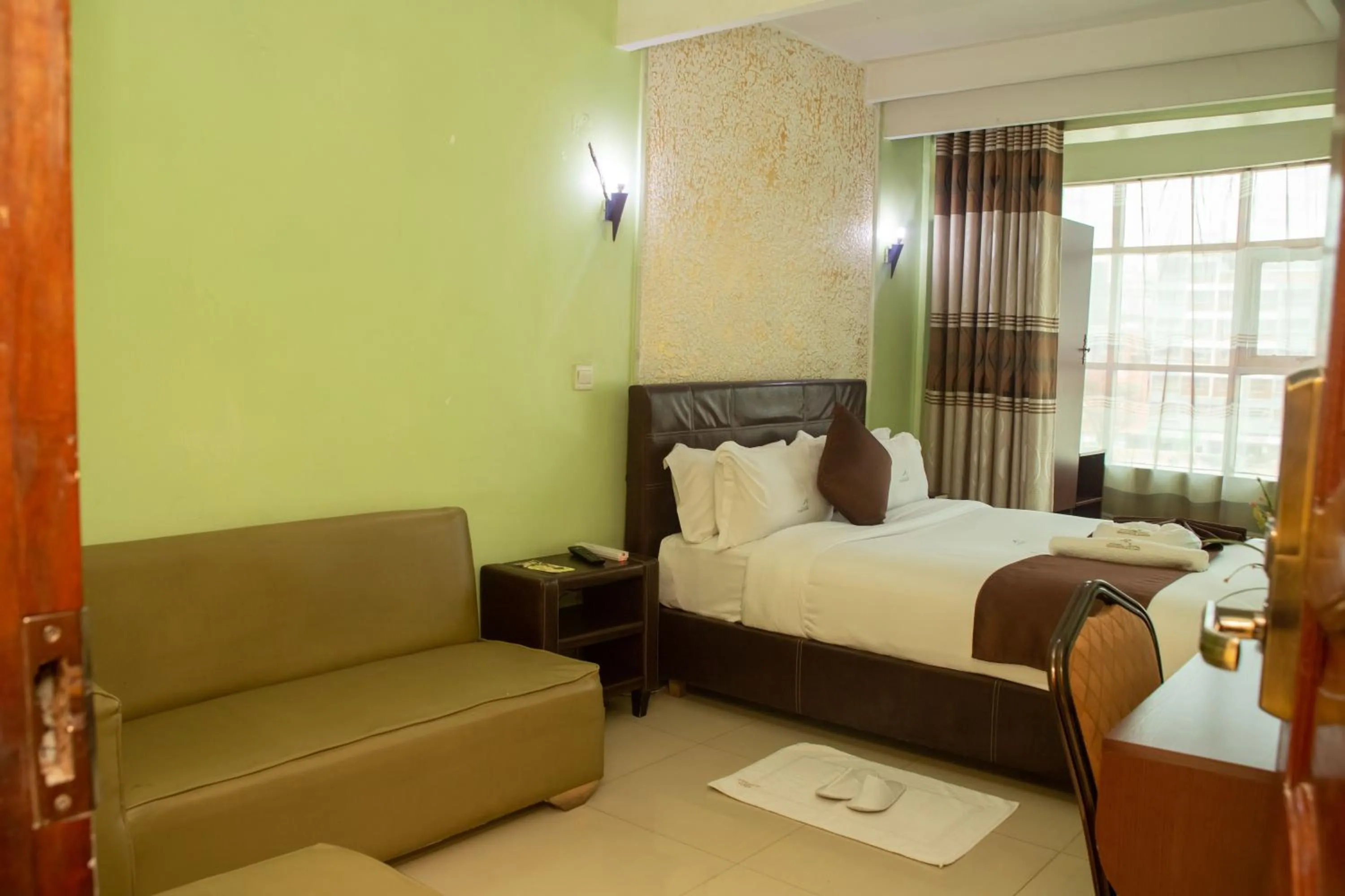 Bed in Legacy Hotel and Conference Centre ltd