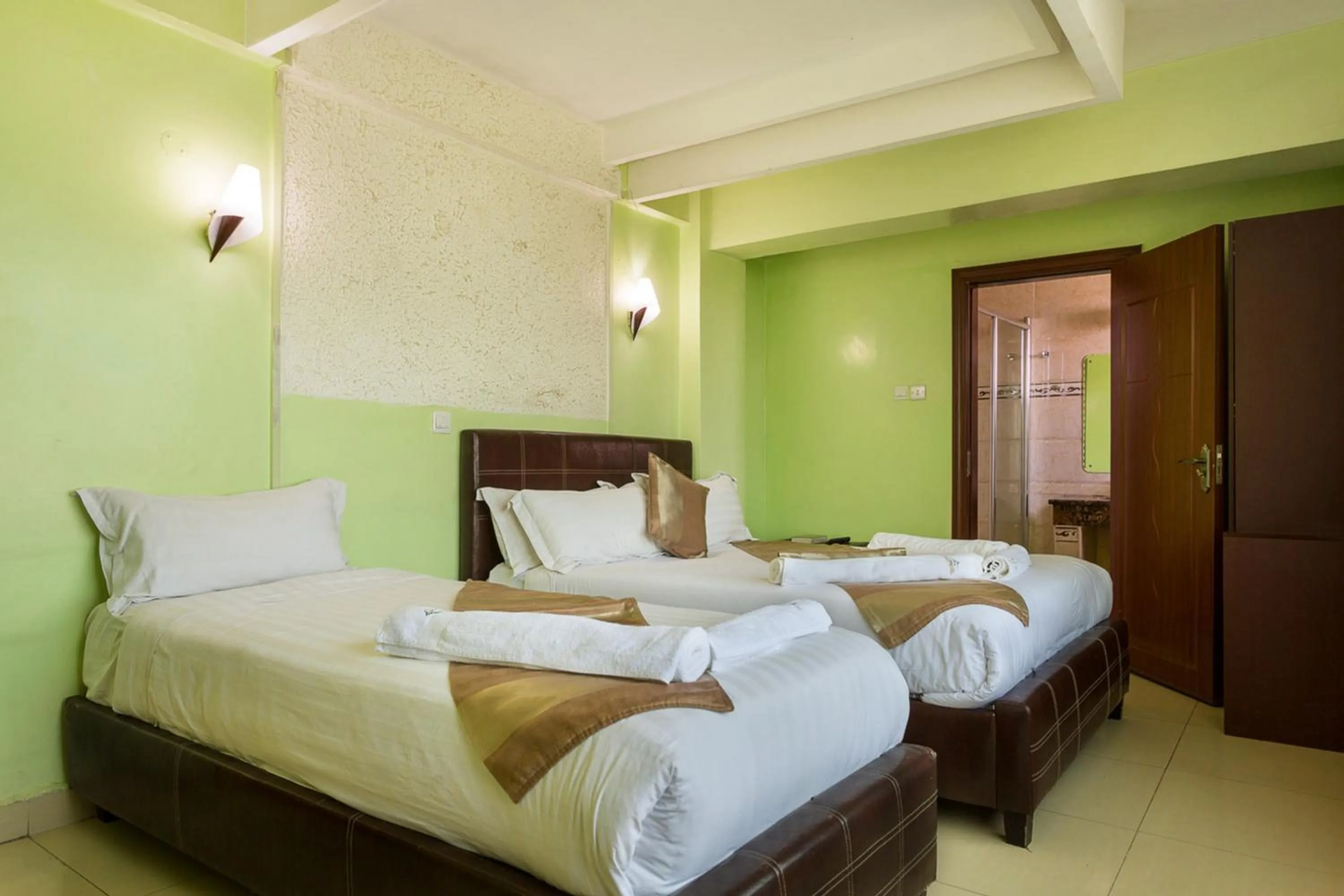 Bed in Legacy Hotel and Conference Centre ltd