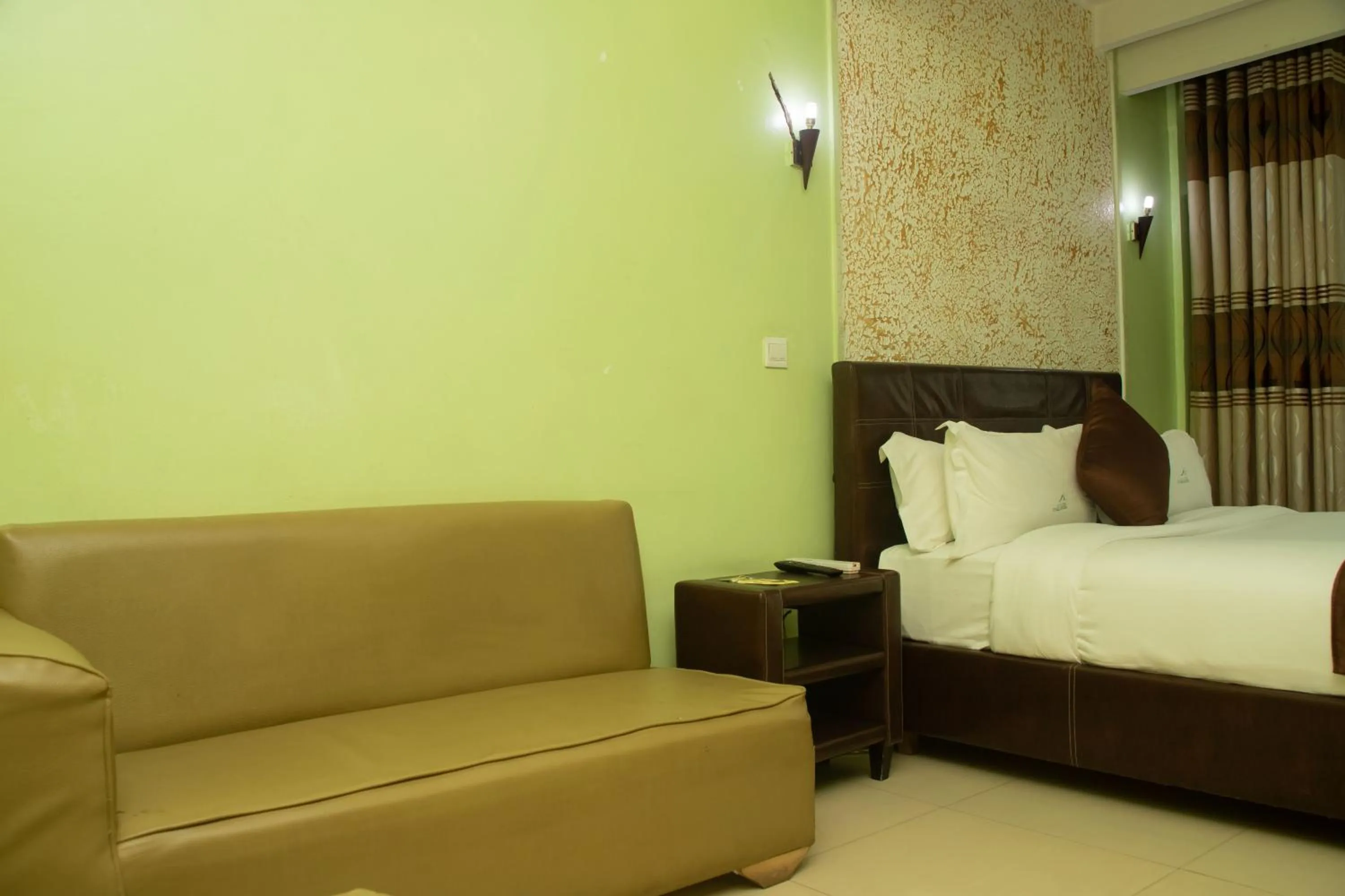 Bed in Legacy Hotel and Conference Centre ltd