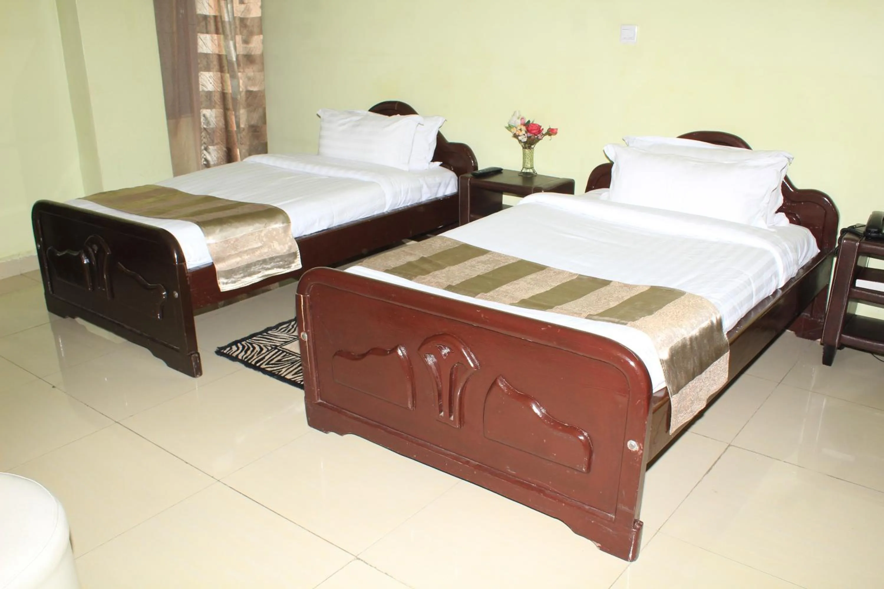 Photo of the whole room, Bed in Legacy Hotel and Conference Centre ltd