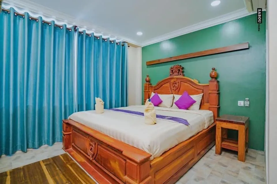 Bed in Neakru Guesthouse and Restaurant