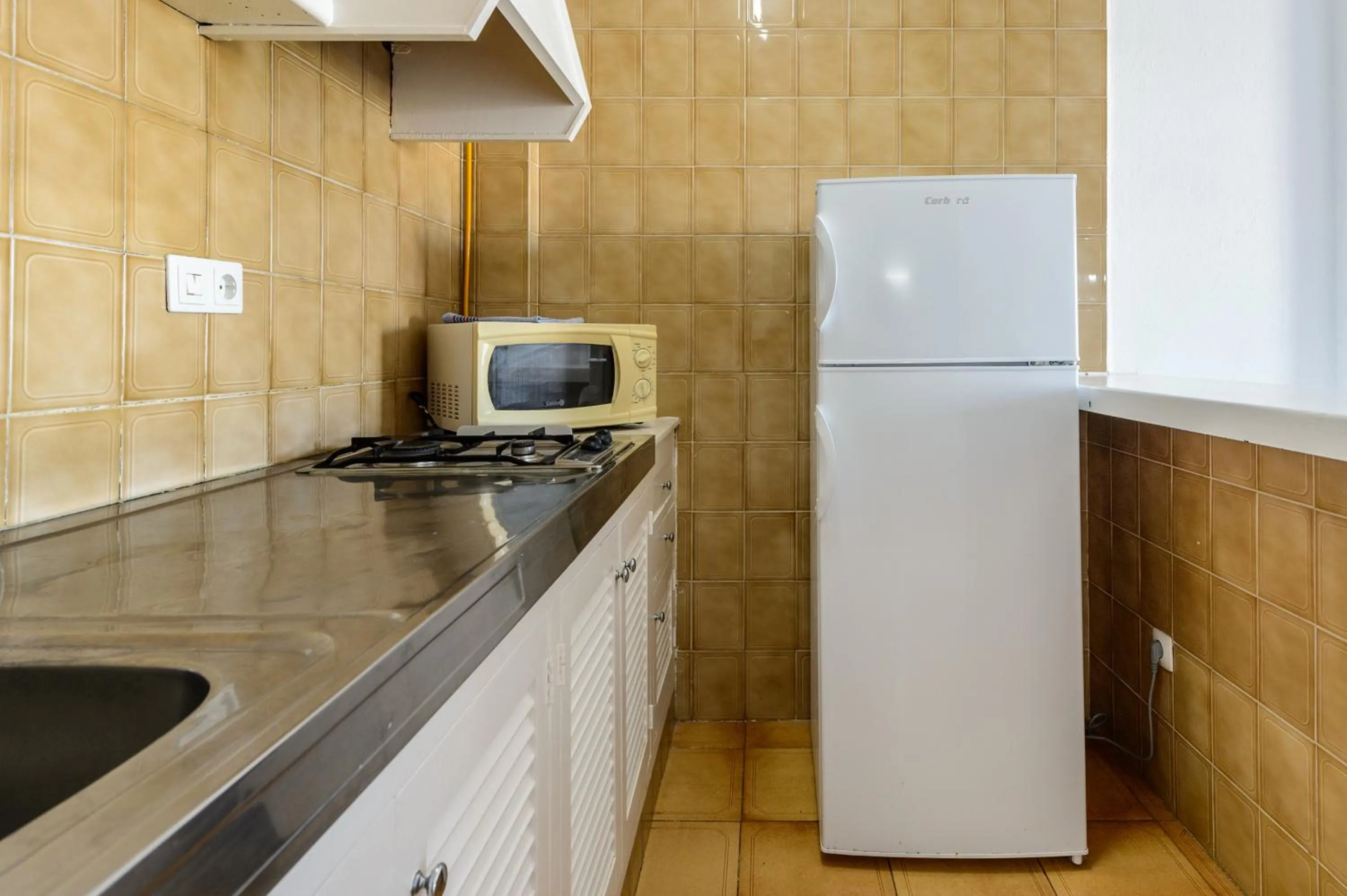 Kitchen or kitchenette in Apartamentos San Antonio Beach