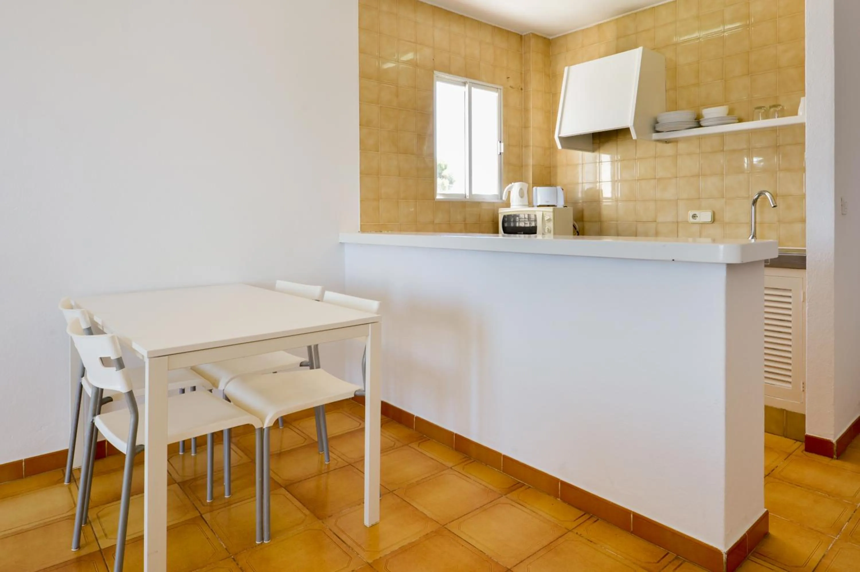 Kitchen or kitchenette in Apartamentos San Antonio Beach