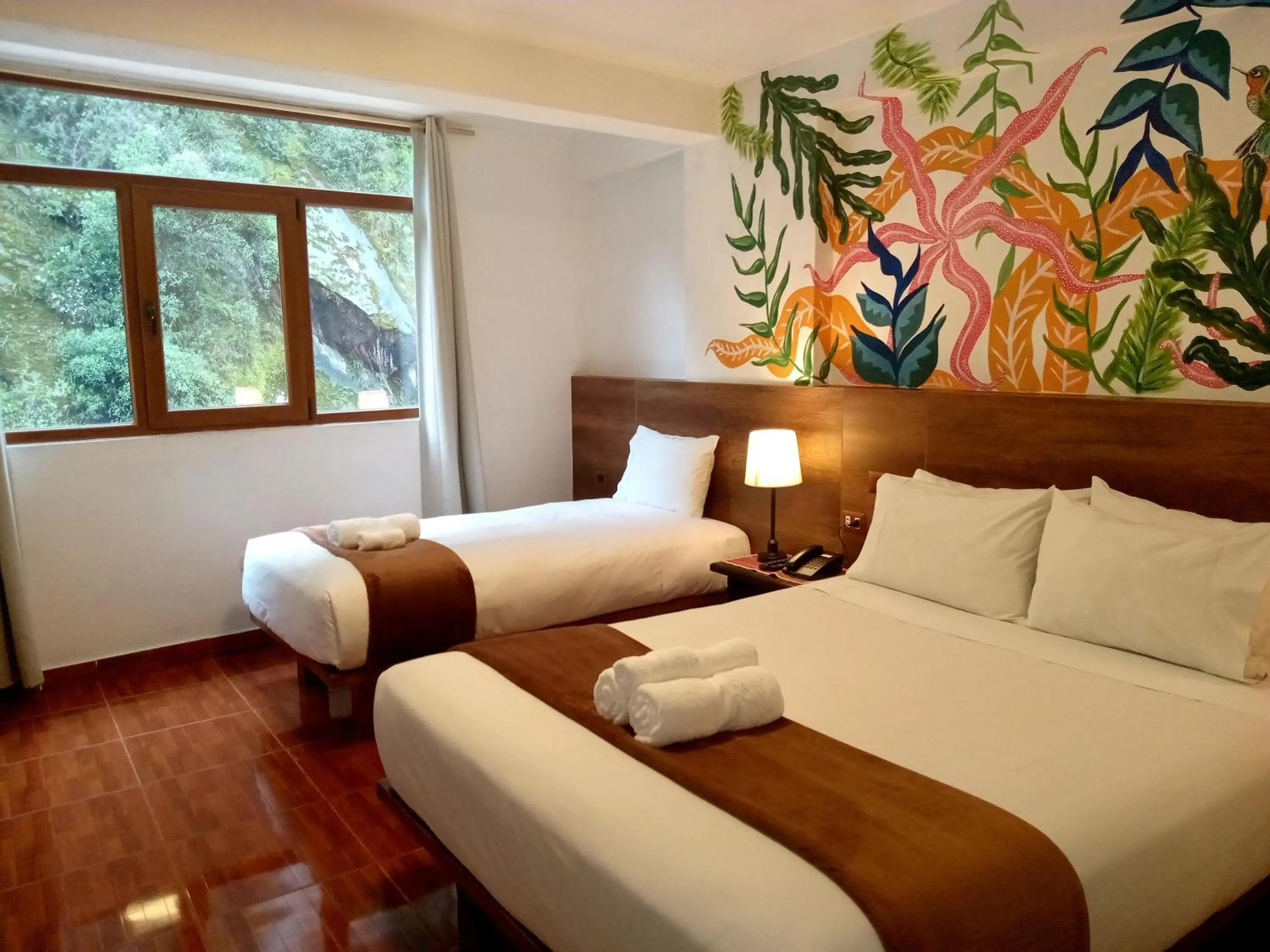 Bed in Susanna Inn MachuPicchu Hotel