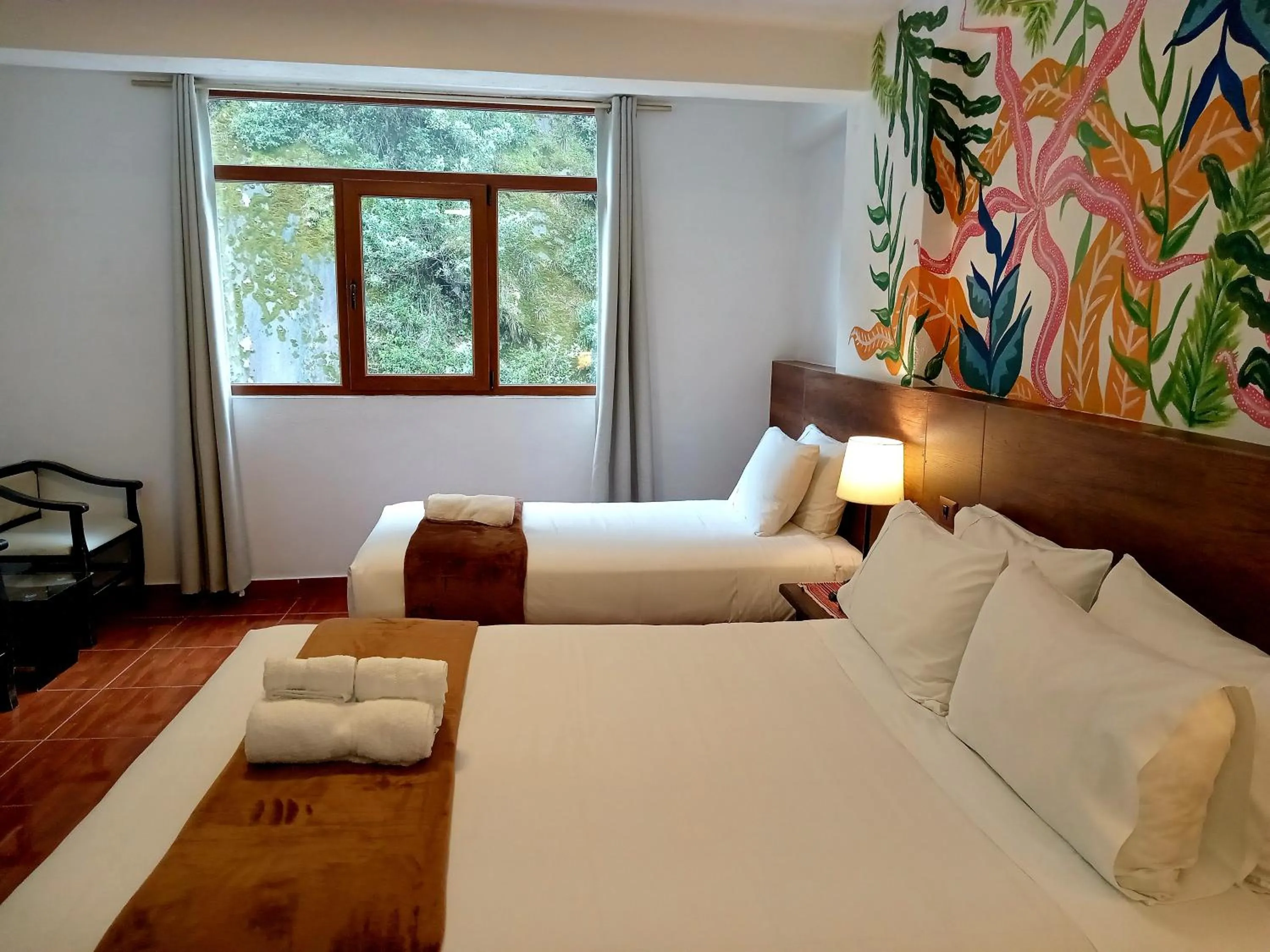 Bed in Susanna Inn MachuPicchu Hotel