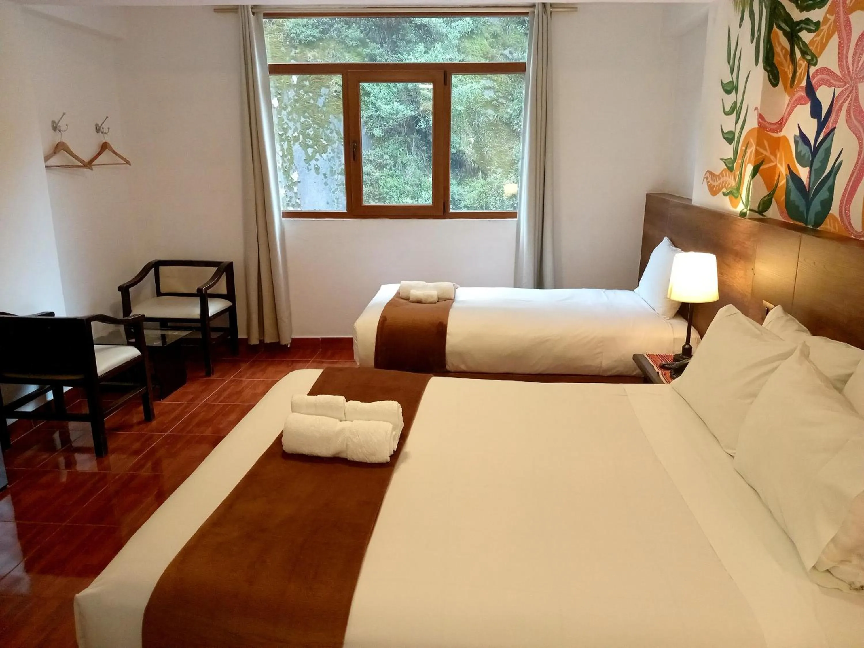 Bed in Susanna Inn MachuPicchu Hotel