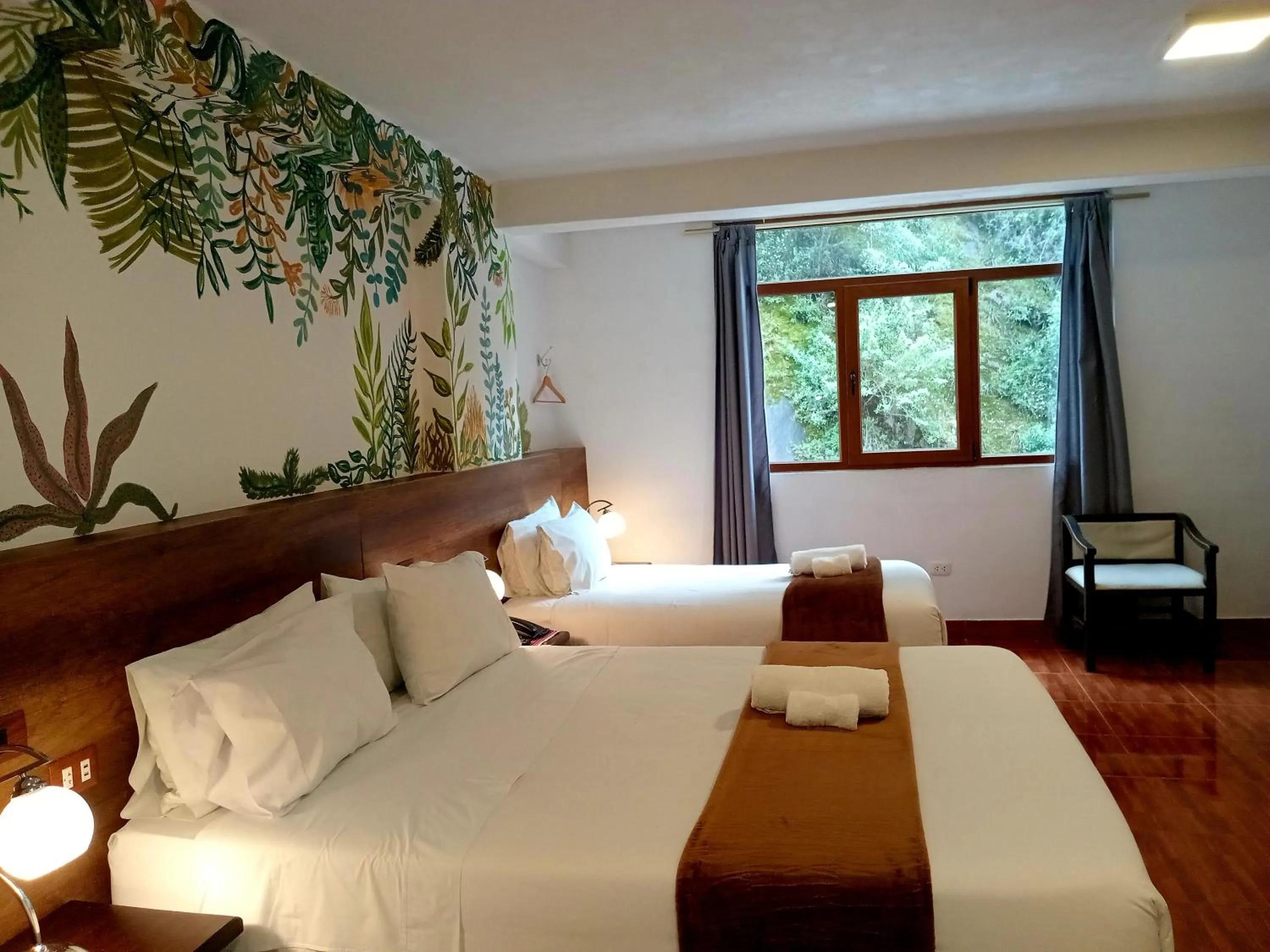 Bed in Susanna Inn MachuPicchu Hotel