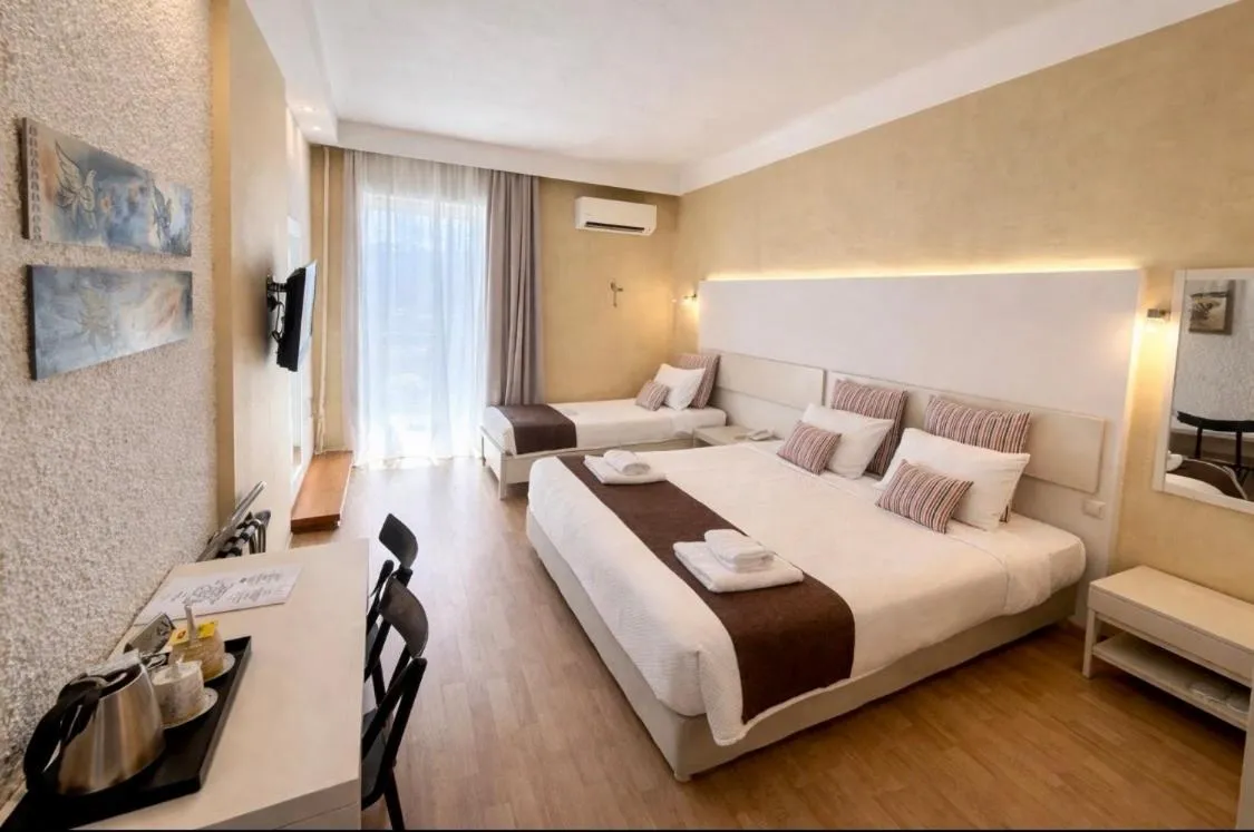 Bed in Nidimos Hotel