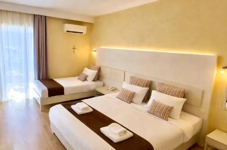 Bed in Nidimos Hotel