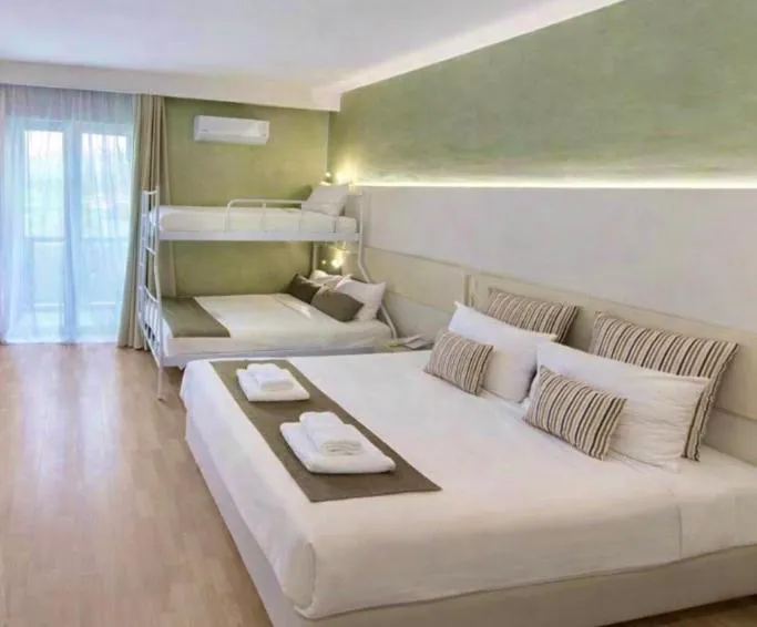 Bed in Nidimos Hotel