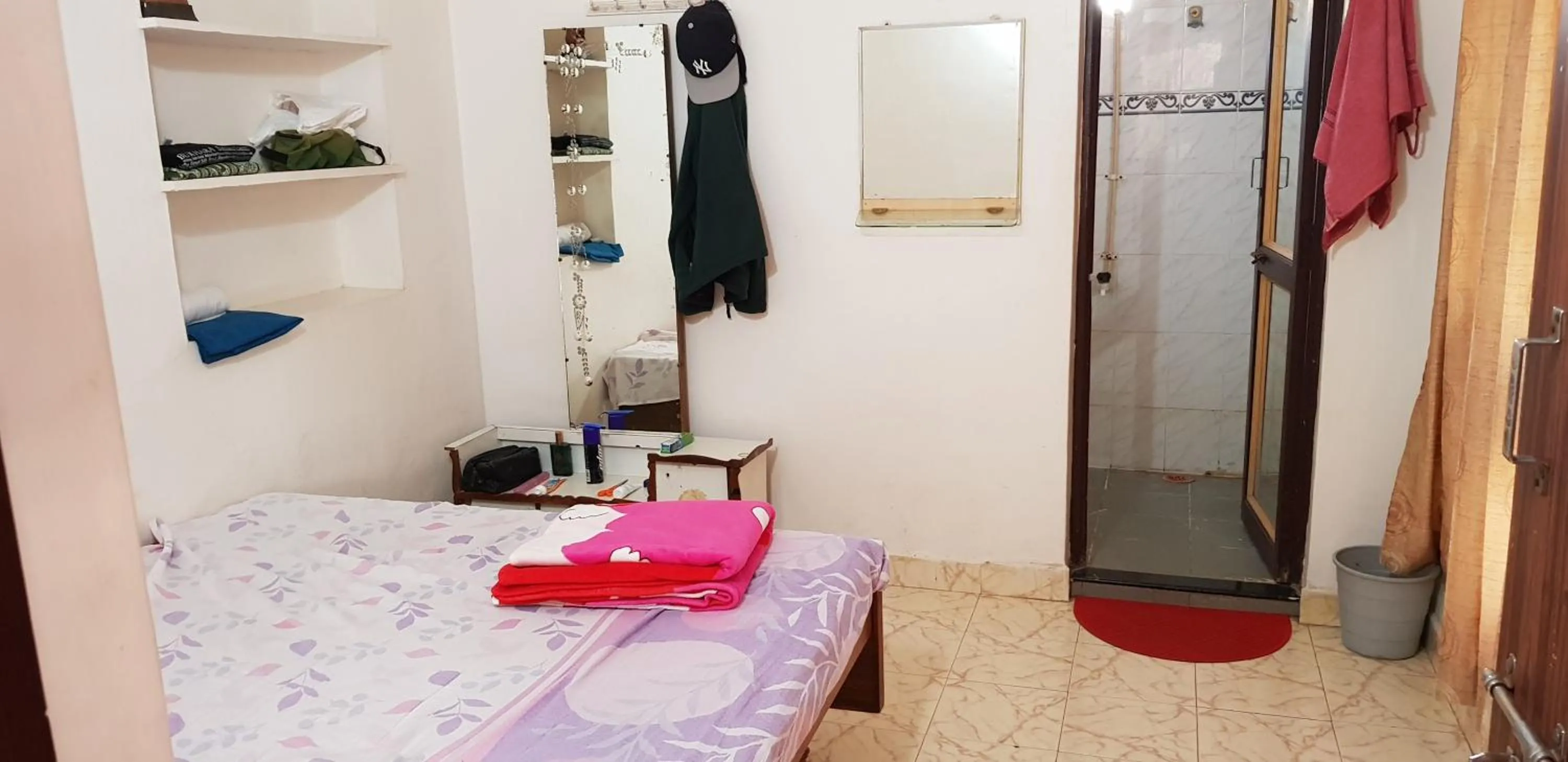 Bed in Padmaa Hampi Villa