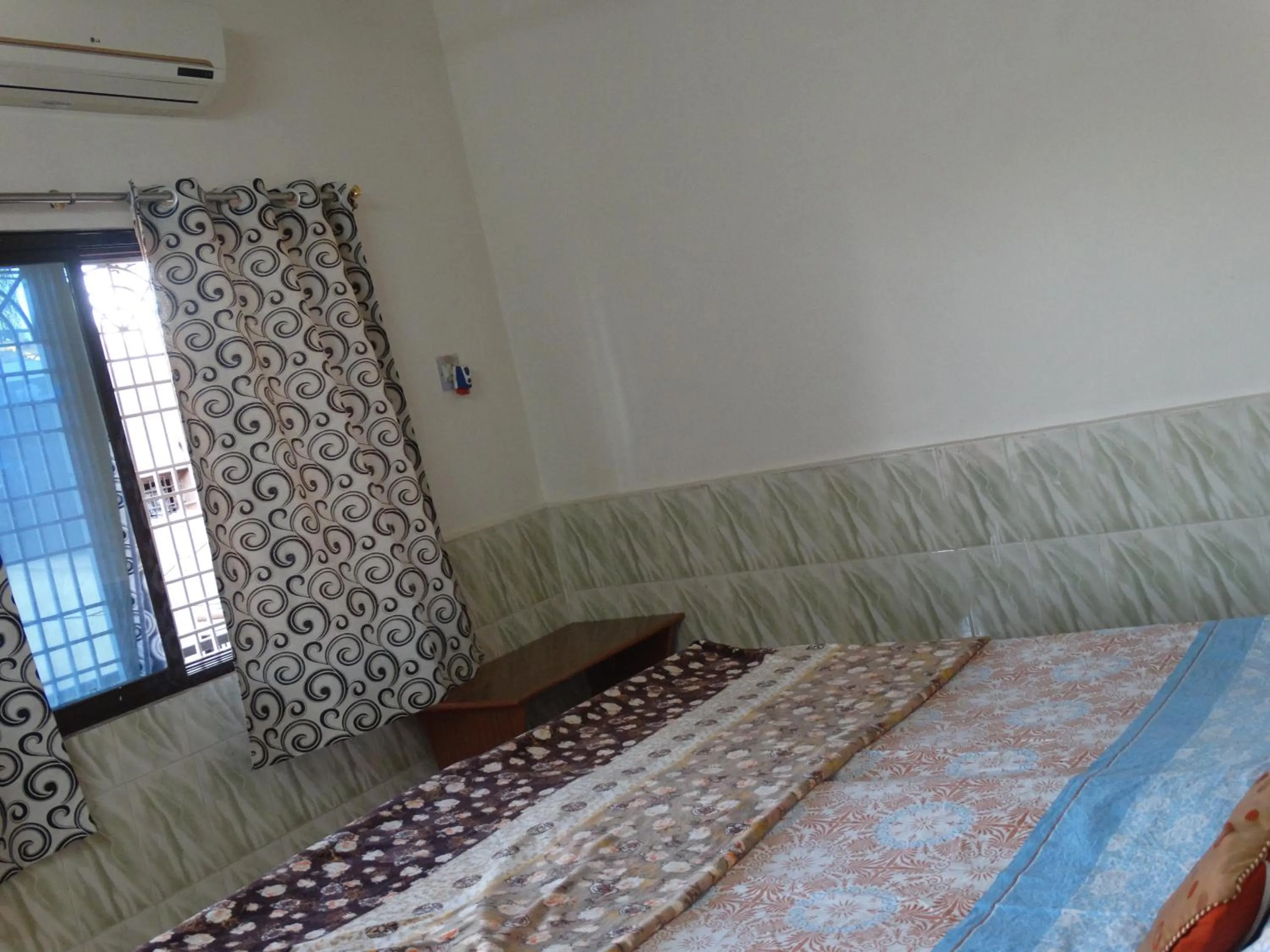 Bed in Padmaa Hampi Villa
