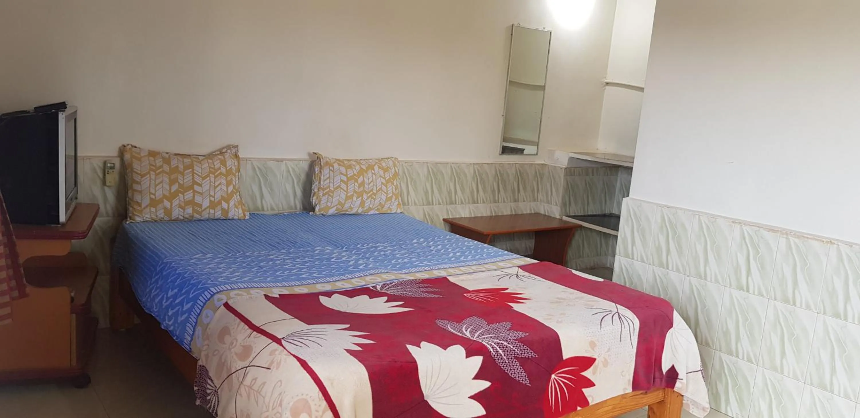 Bed in Padmaa Hampi Villa