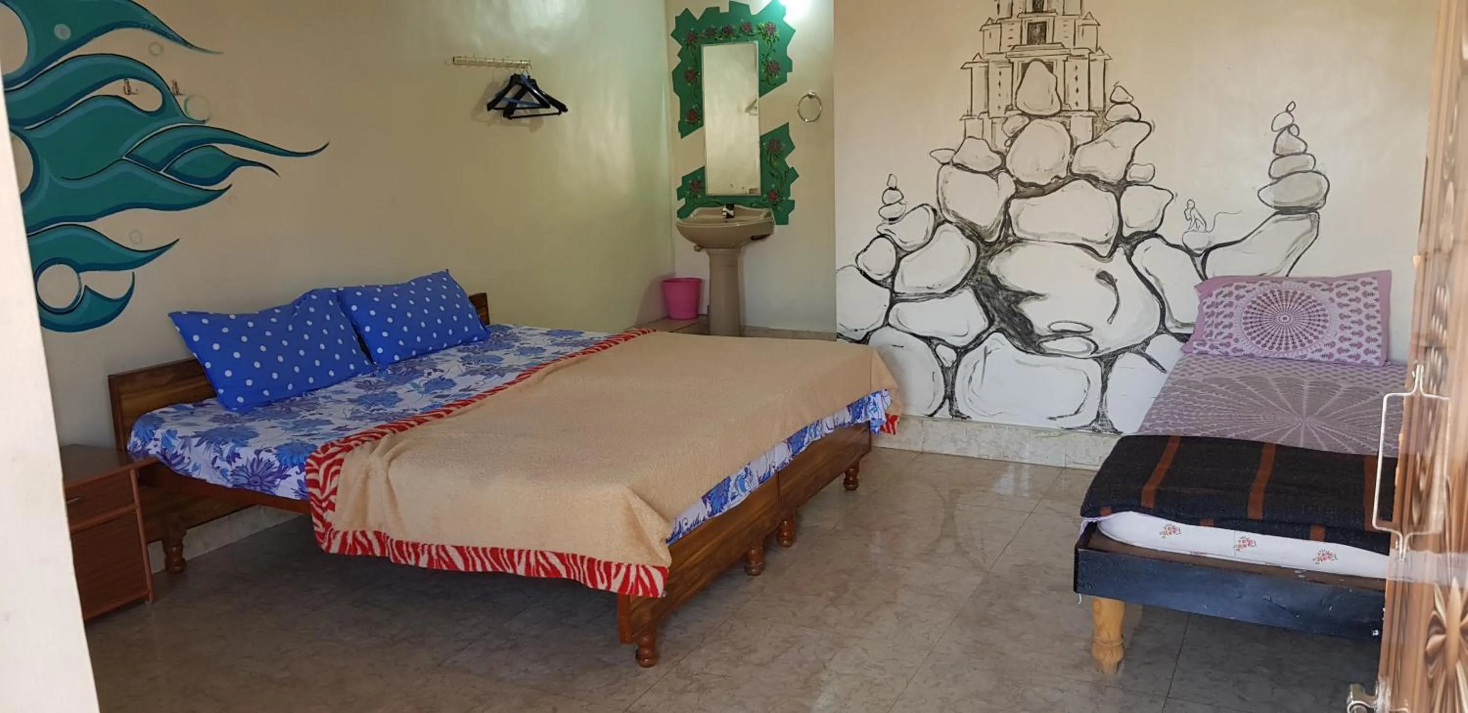 Bed in Padmaa Hampi Villa