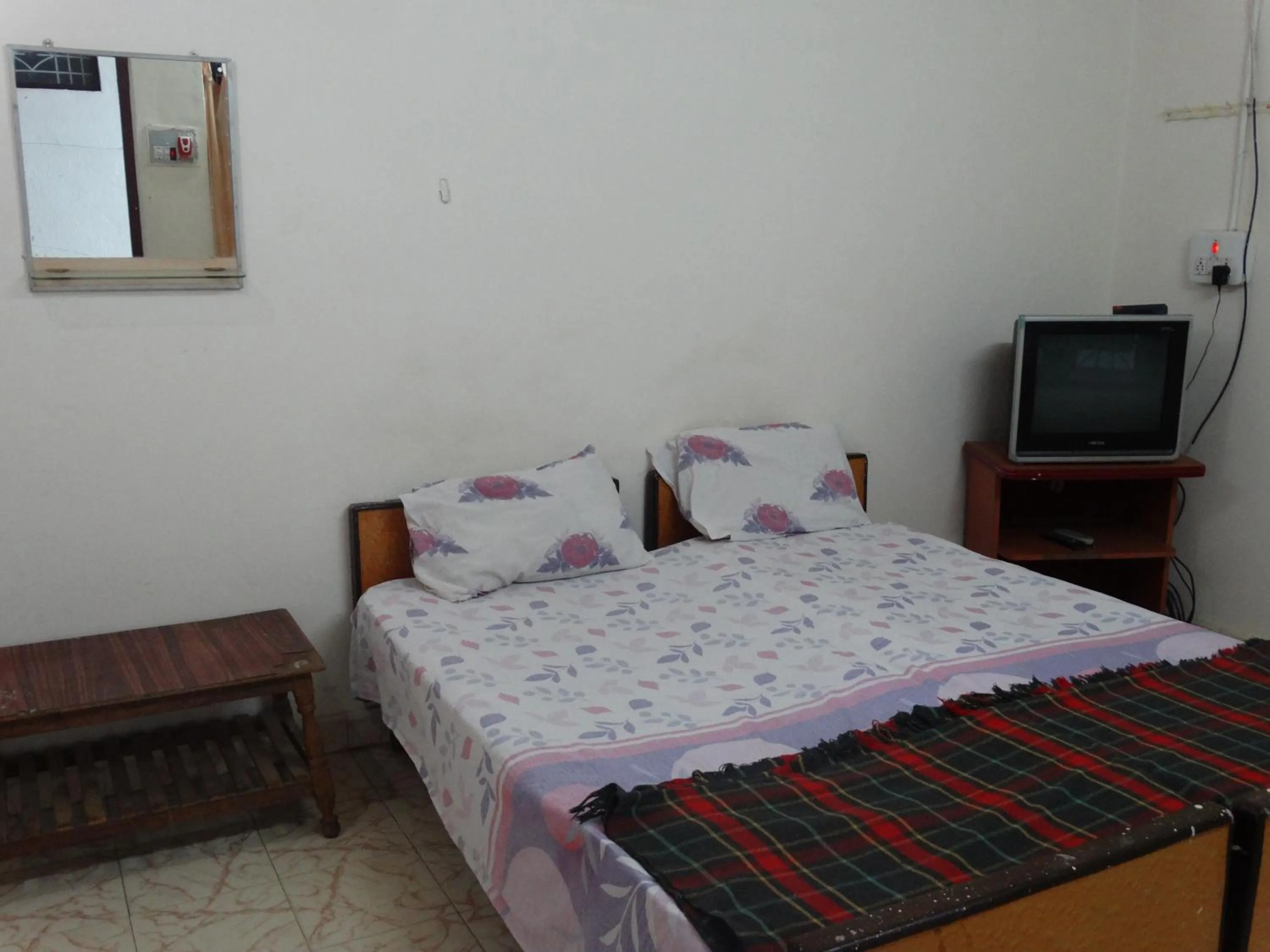 Bed in Padmaa Hampi Villa
