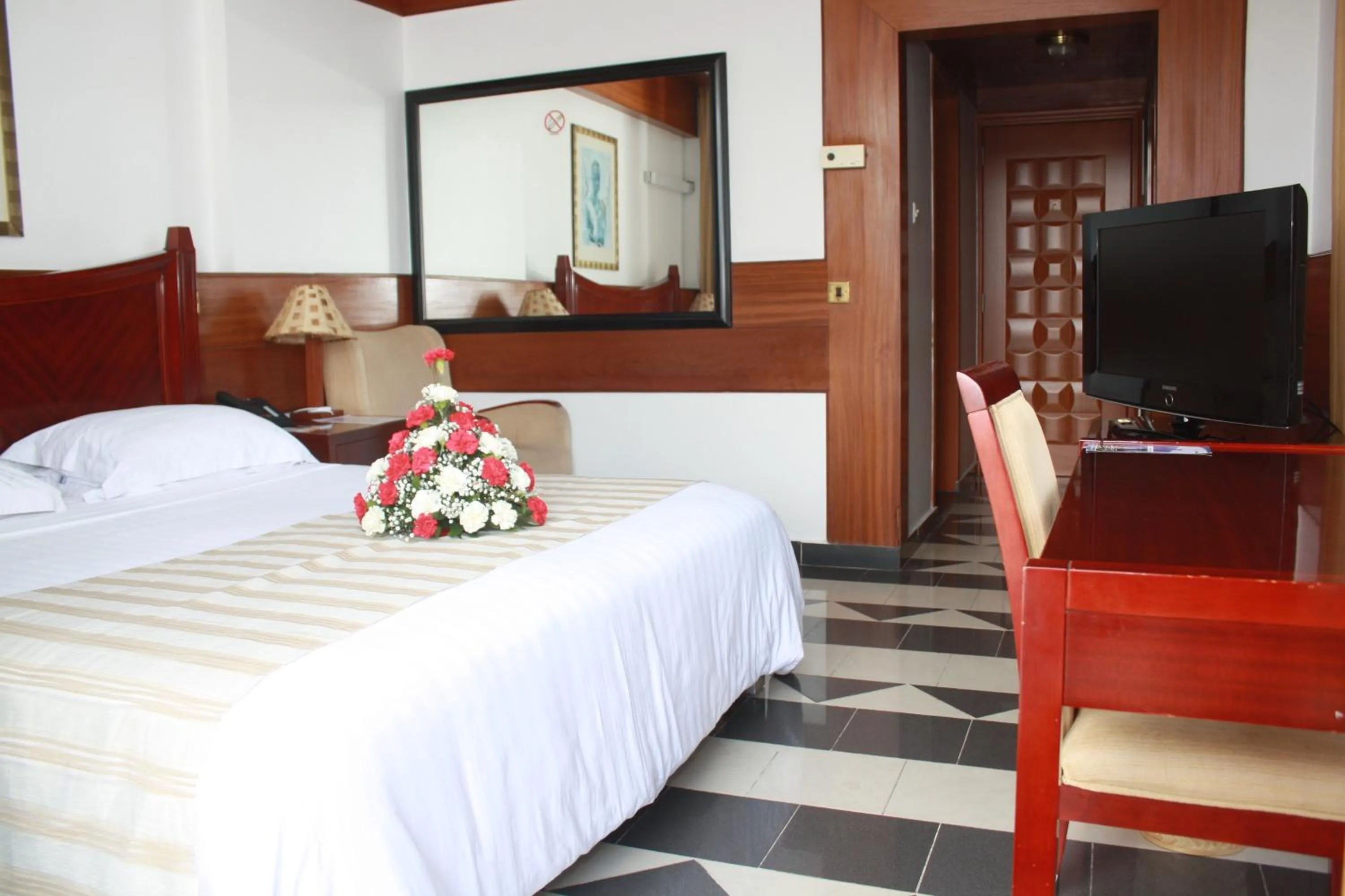 Bed in Peacock Hotel