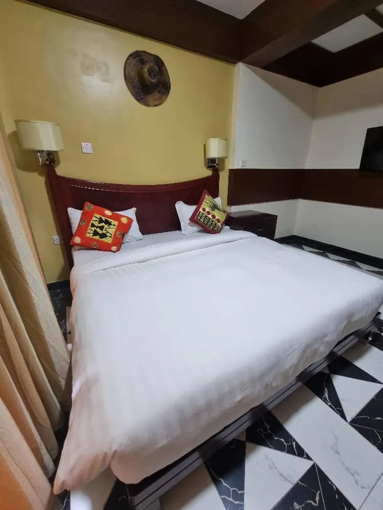 Bed in Peacock Hotel