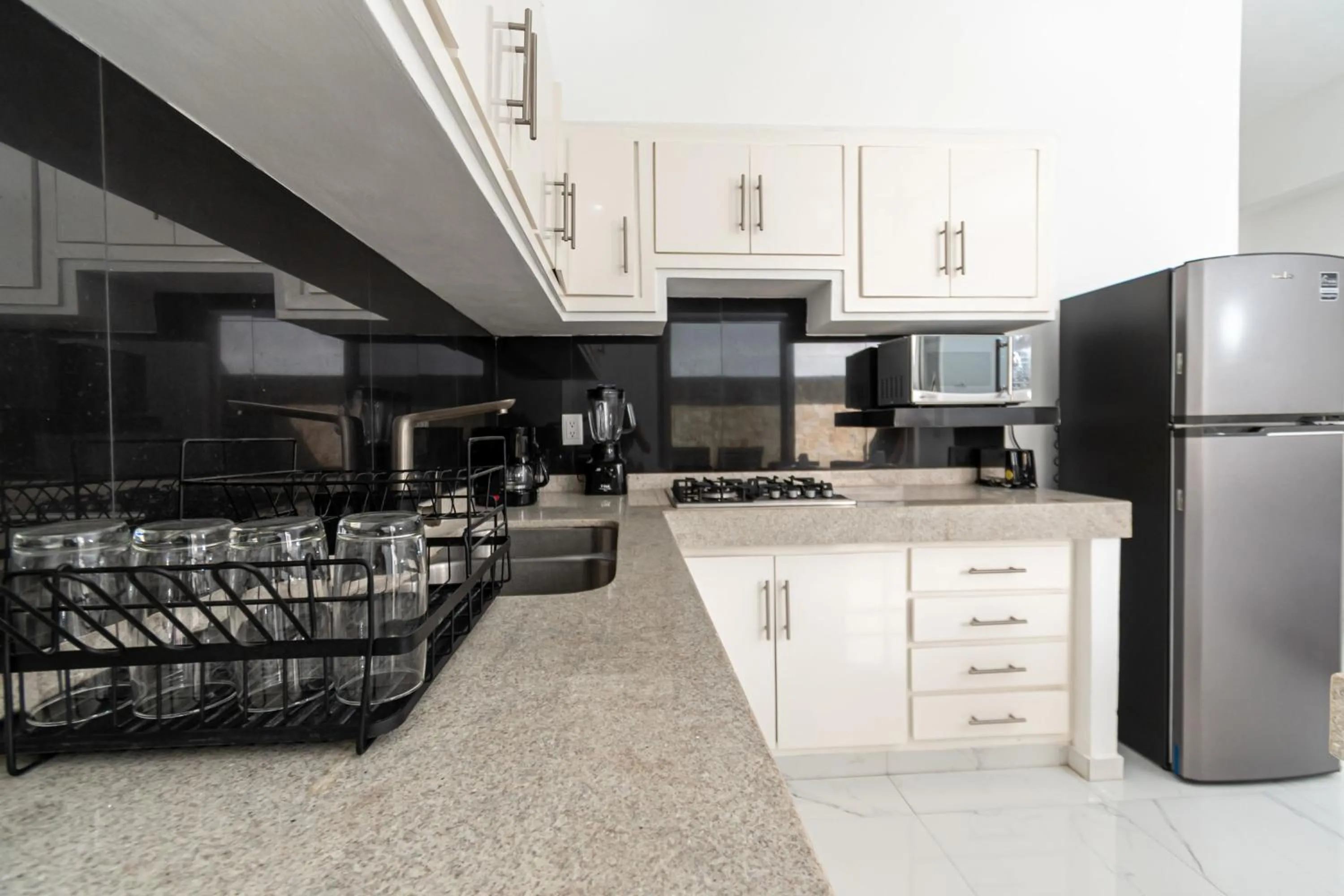 Kitchen or kitchenette in Safiro Suites Guayabitos Apartments - Adults Only