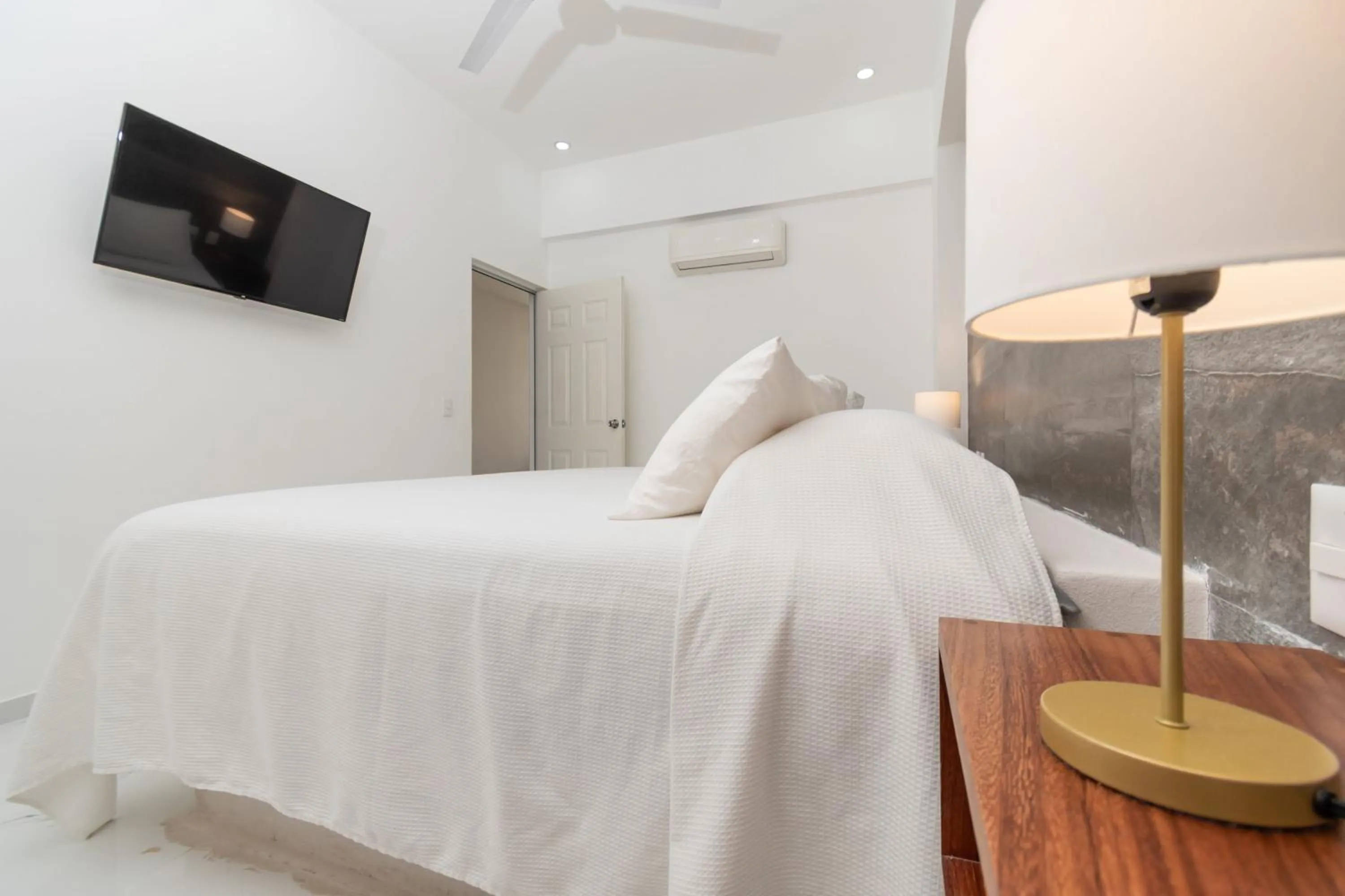 Bed in Safiro Suites Guayabitos Apartments - Adults Only