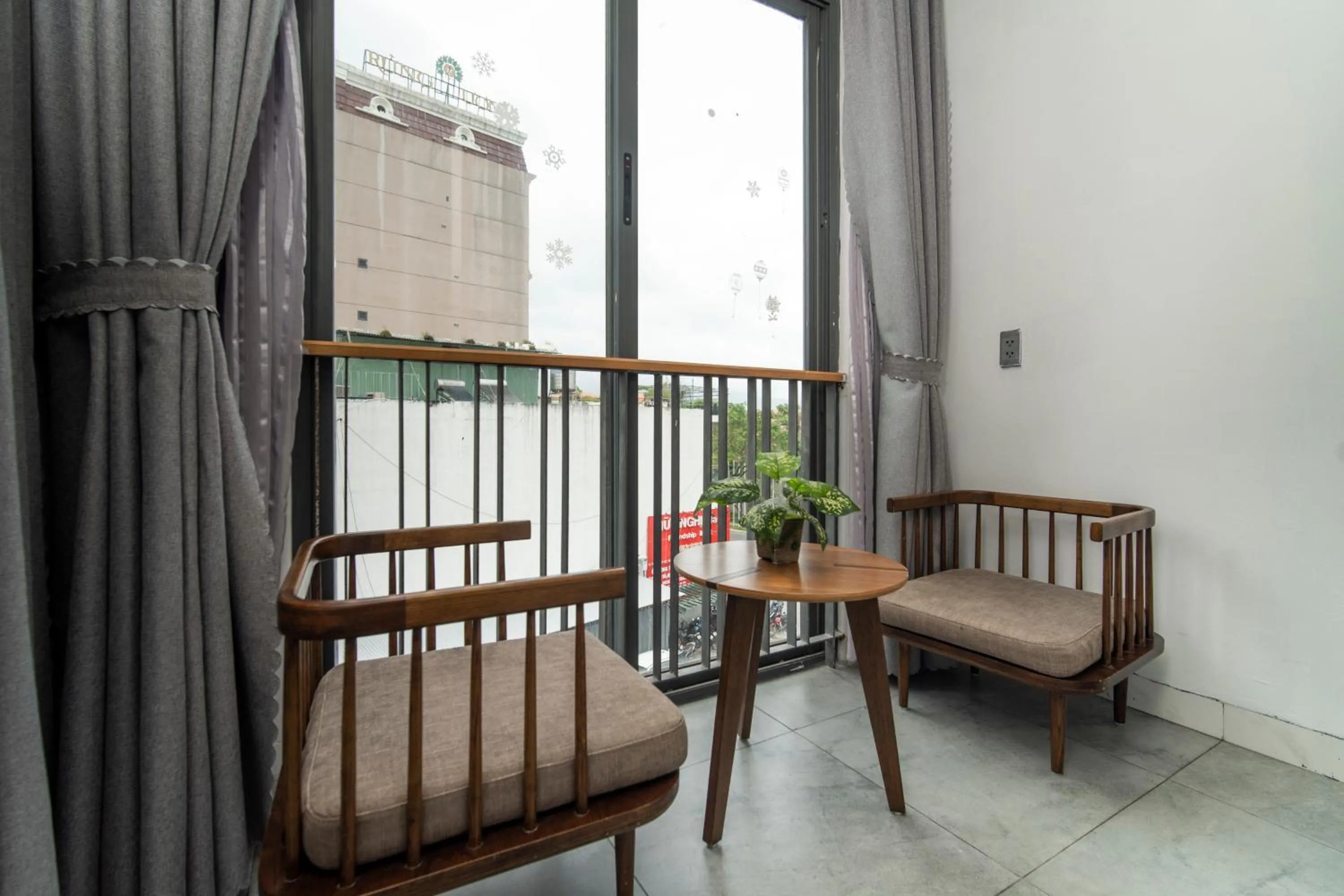Seating area in DOMA by HSuites Hotel & Apartment